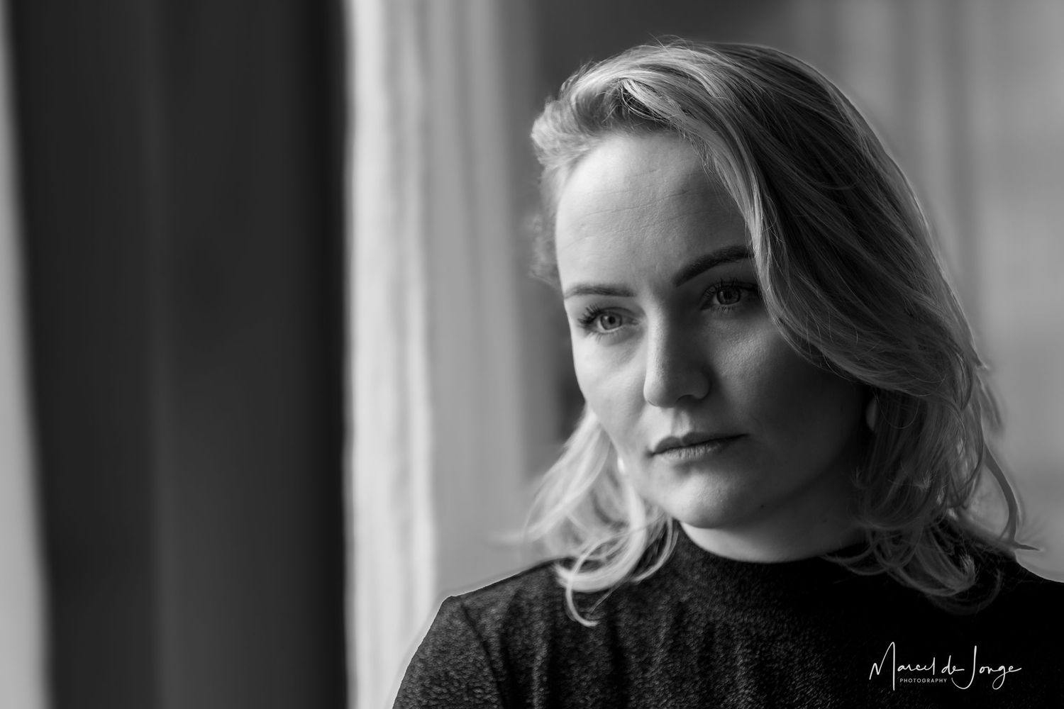 Black and white portrait series showing dramatic lighting and shadows against a dark background.