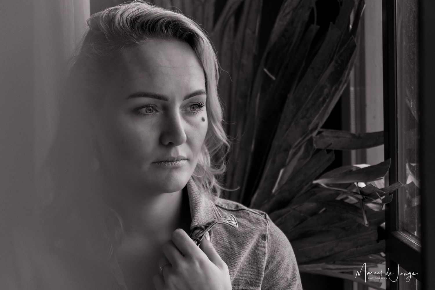 A series of black and white portraits showing a person smoking a cigarette while looking contemplative.