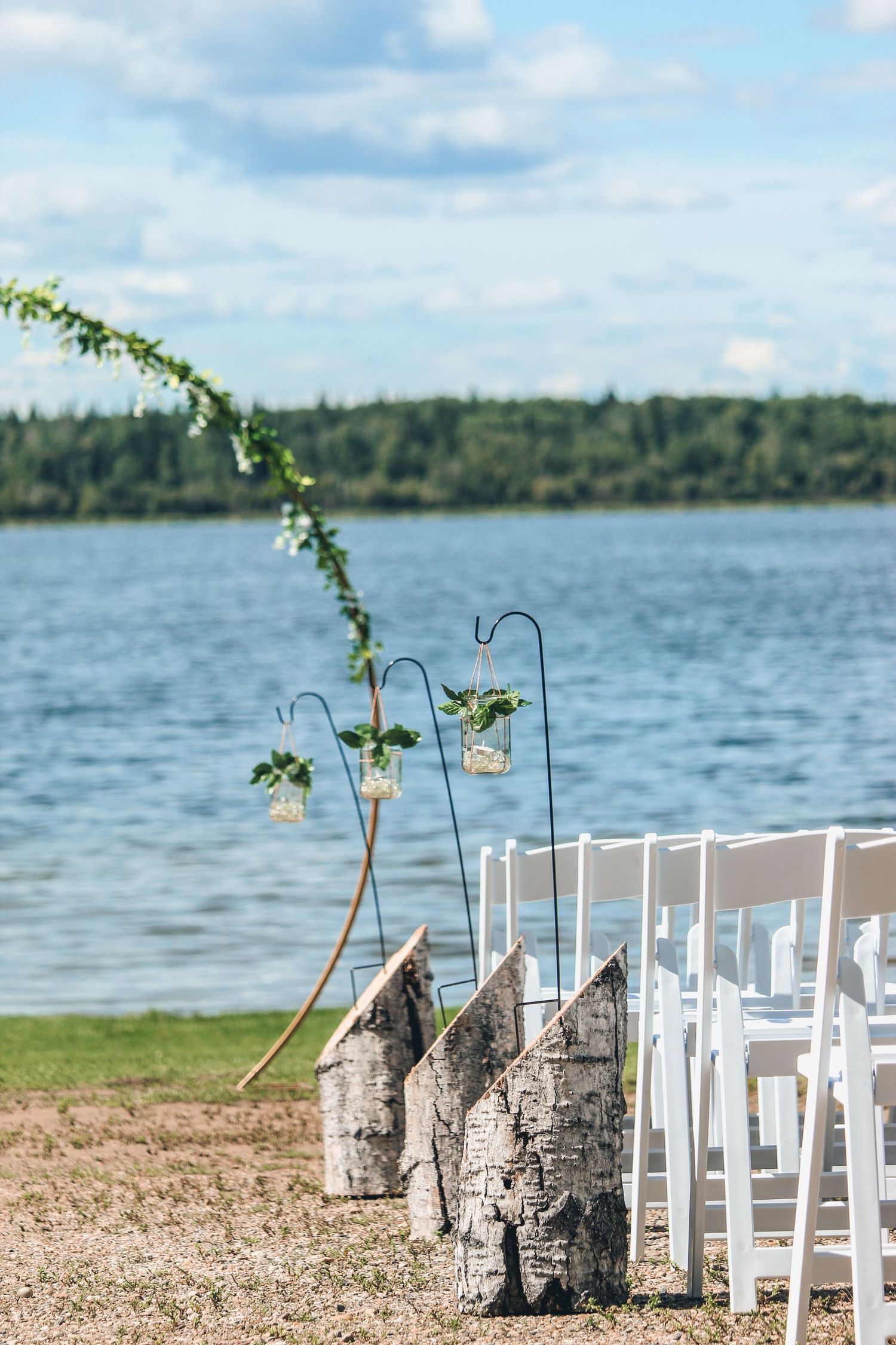 Wedding detail of aisle in front of Leddy Lake, AB