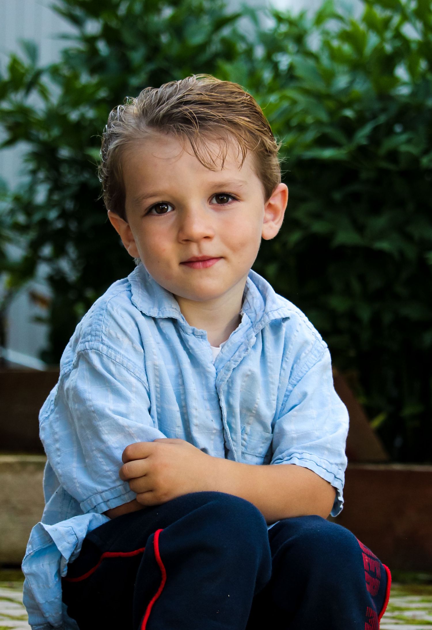 Little boy sitting near Rocky Mountain House, AB