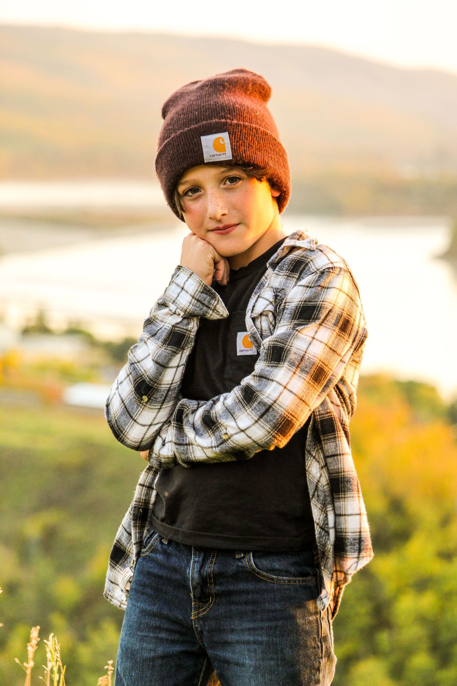 Boy in Carrhart overlooking Peace River, AB