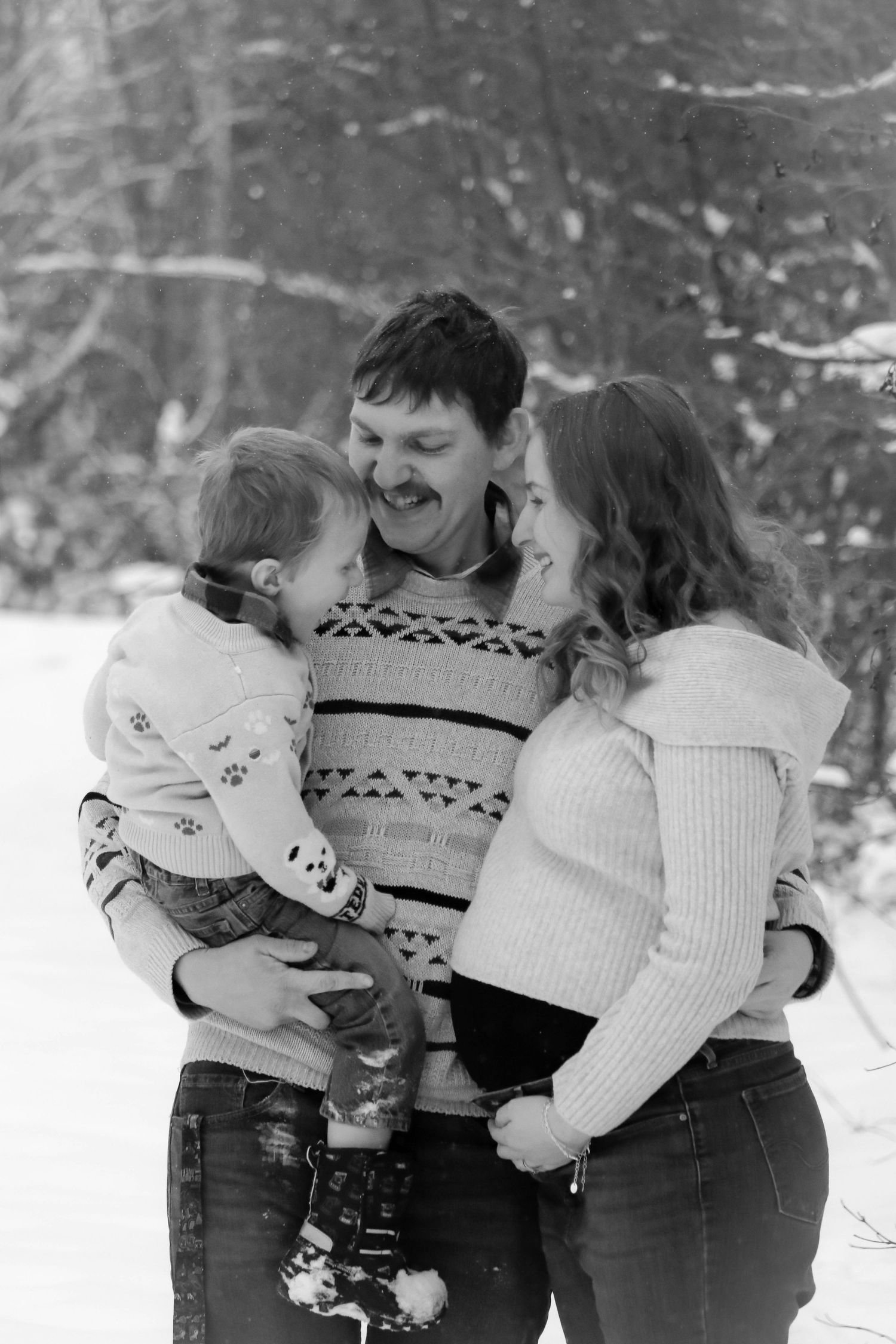 young family, dad, mom, boy, winter portrait at Wilderness Park
