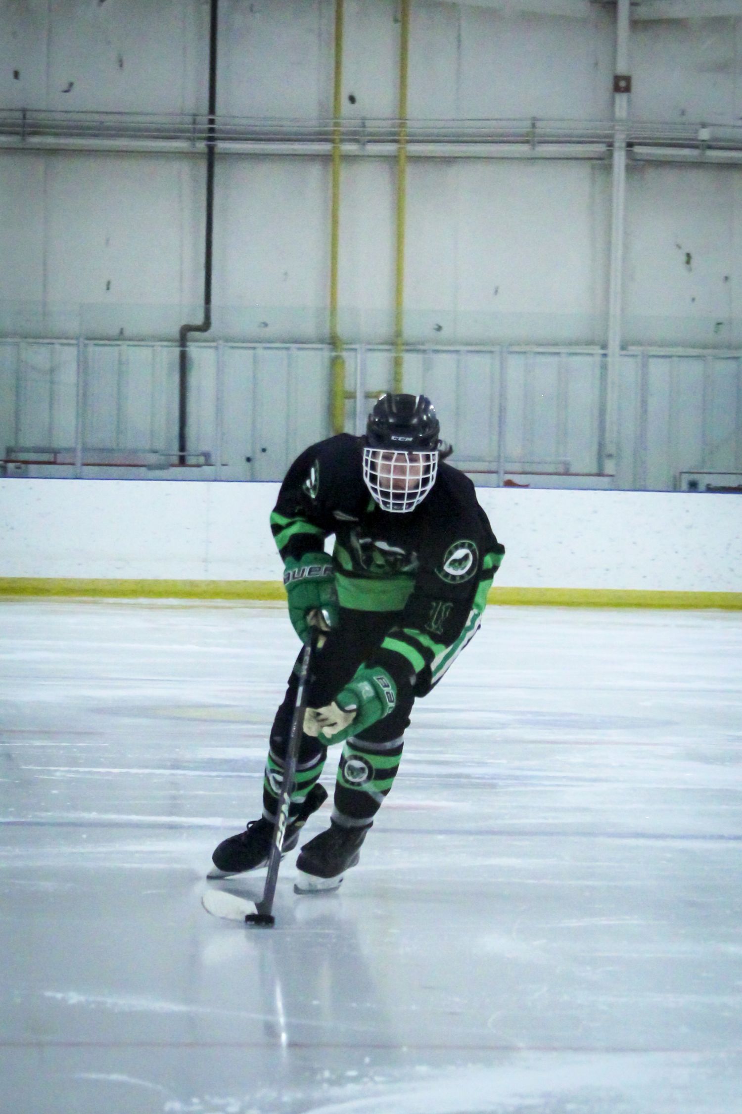 Boy playing hockey, Rocky Mountain House, AB