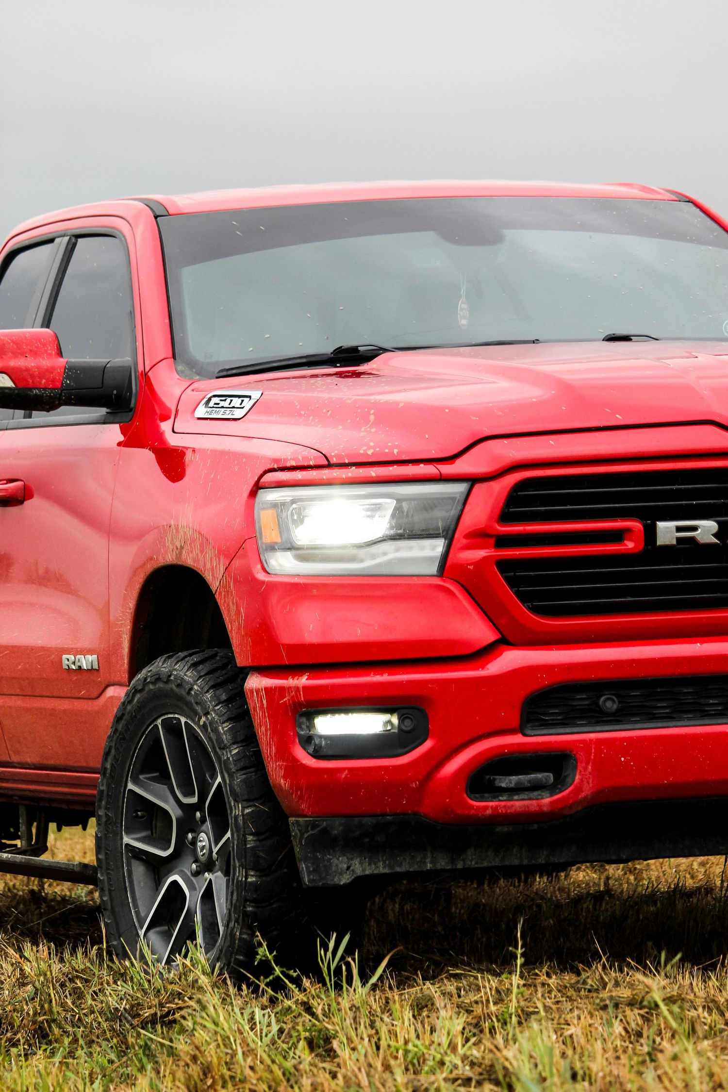 Red dodge truck front corner angle in field outside Fairview, AB