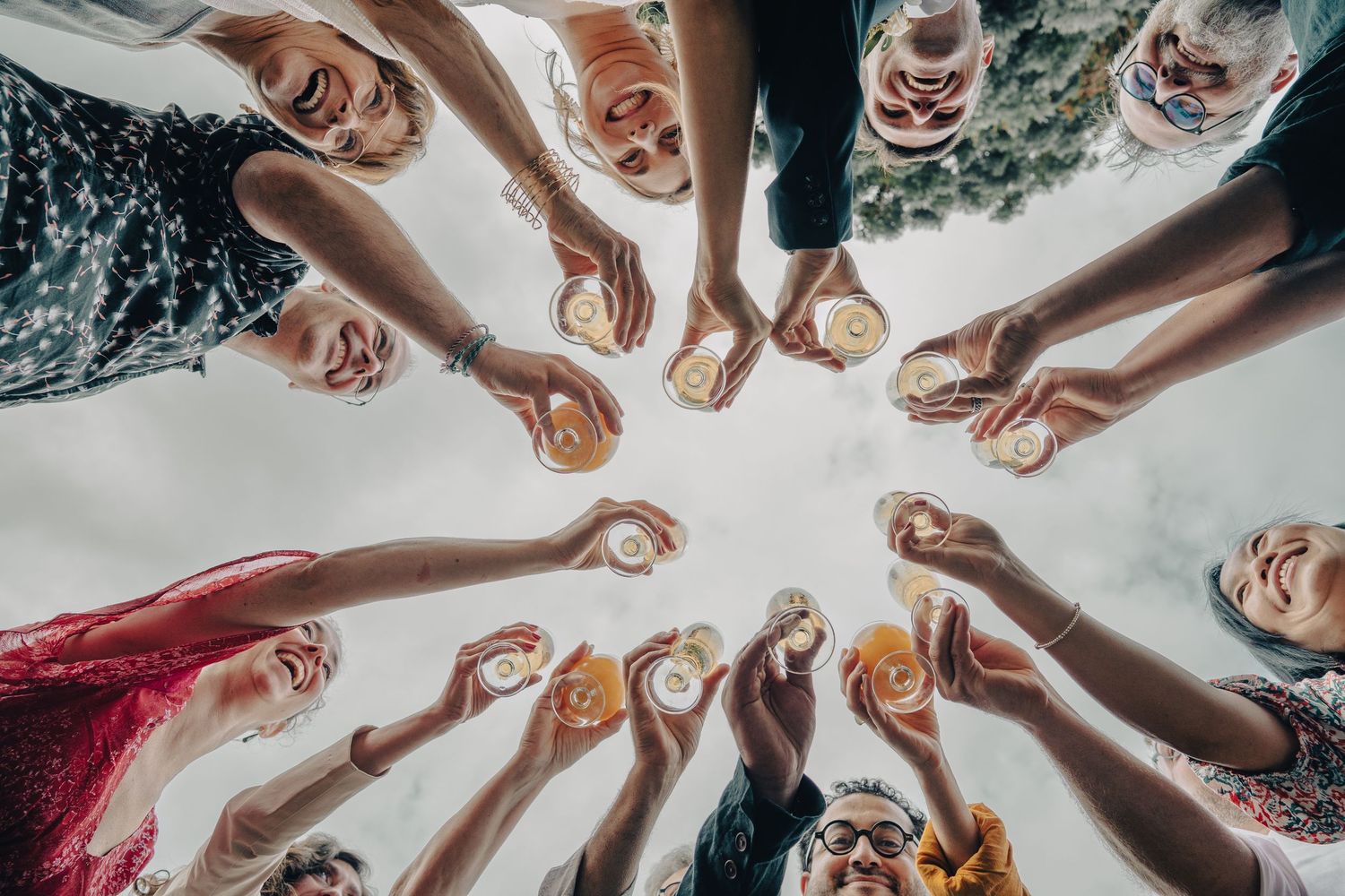 A creative overhead shot of hands forming a circle against a white background.
