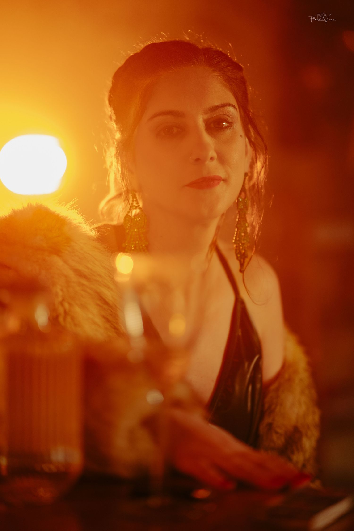 Dramatic portrait series bathed in warm orange sunset lighting with ethereal atmosphere.
