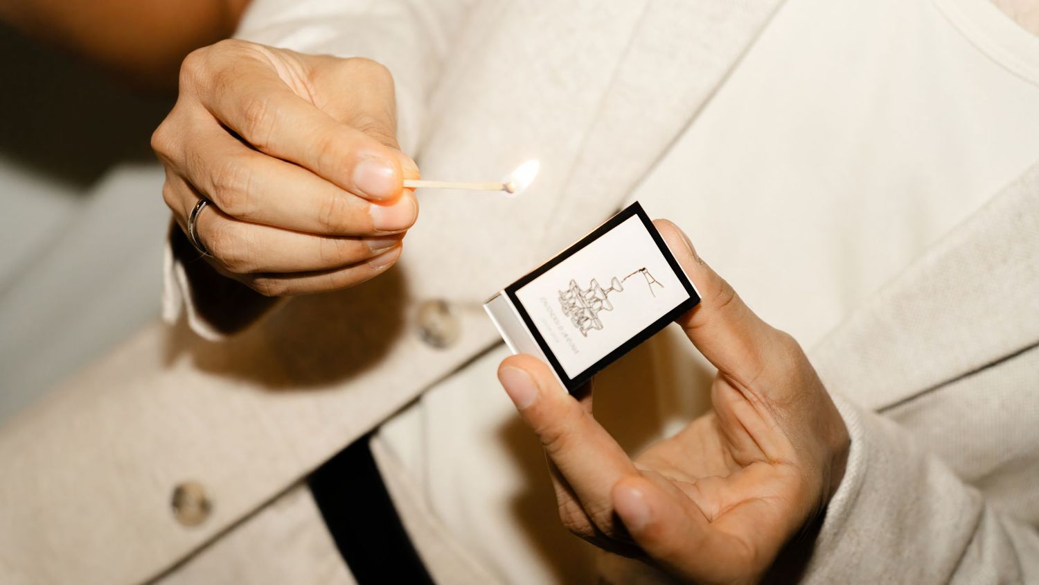 A series of hands holding pens and writing notes on white paper in a business or educational setting.
