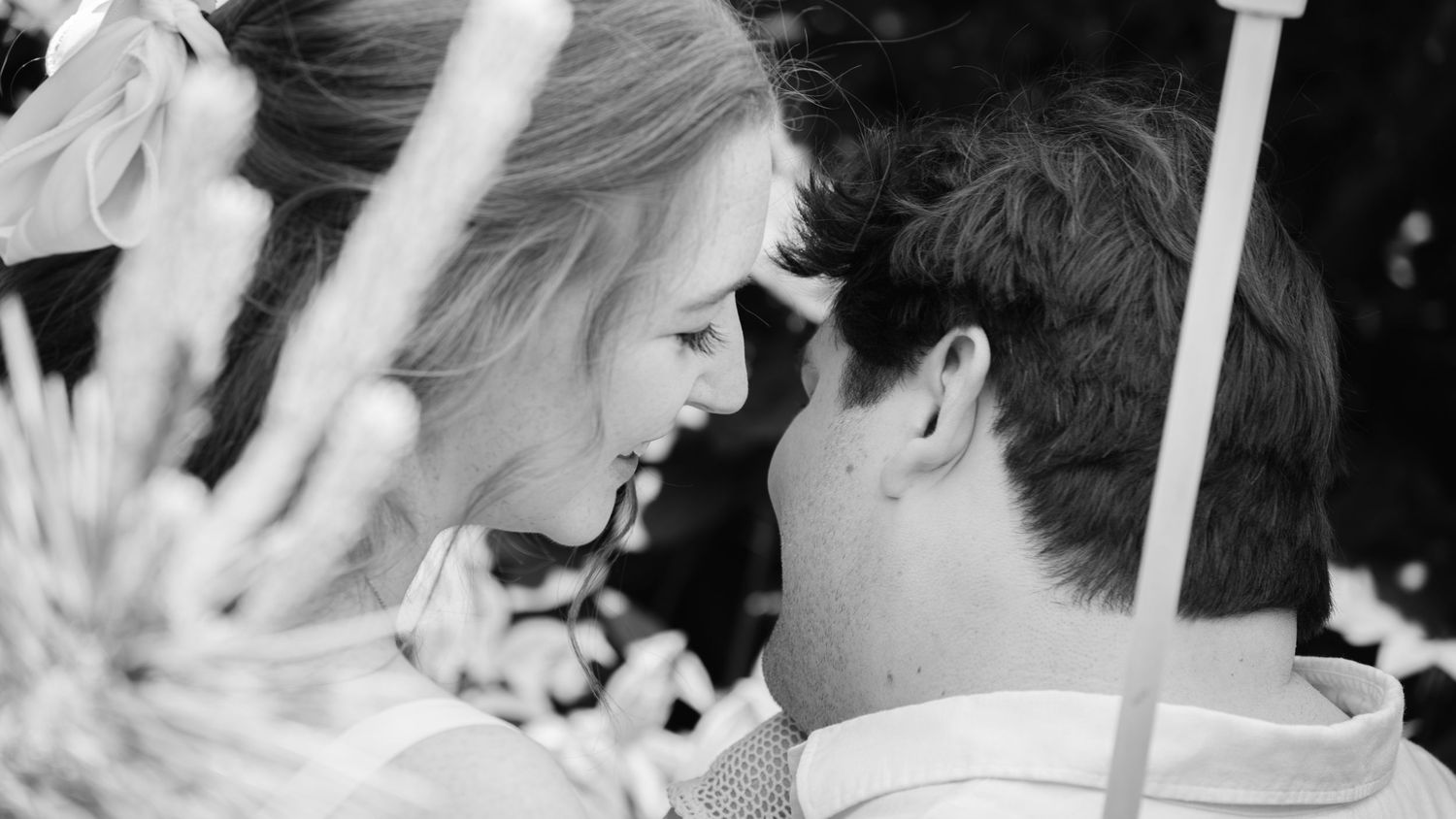 Close-up black and white photo series showing tender moments between two people.