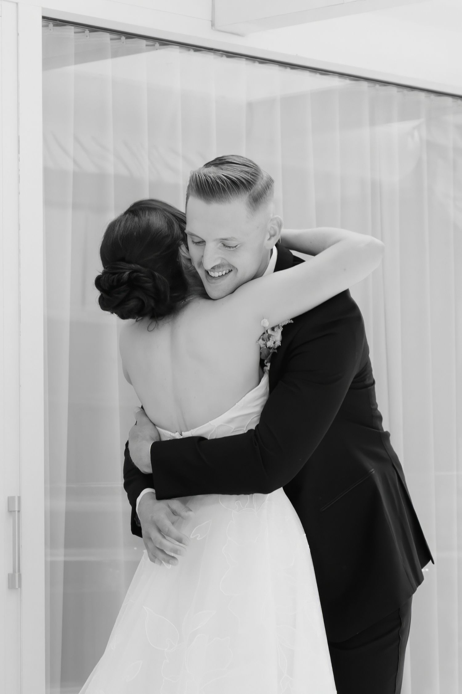 Black and white sequence of intimate wedding moment in bright modern interior.