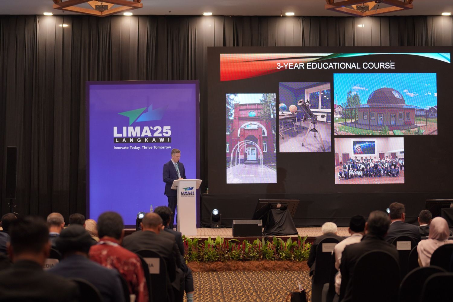 Conference presentation showing LIMA25 logo and educational course slides on large display screen.
