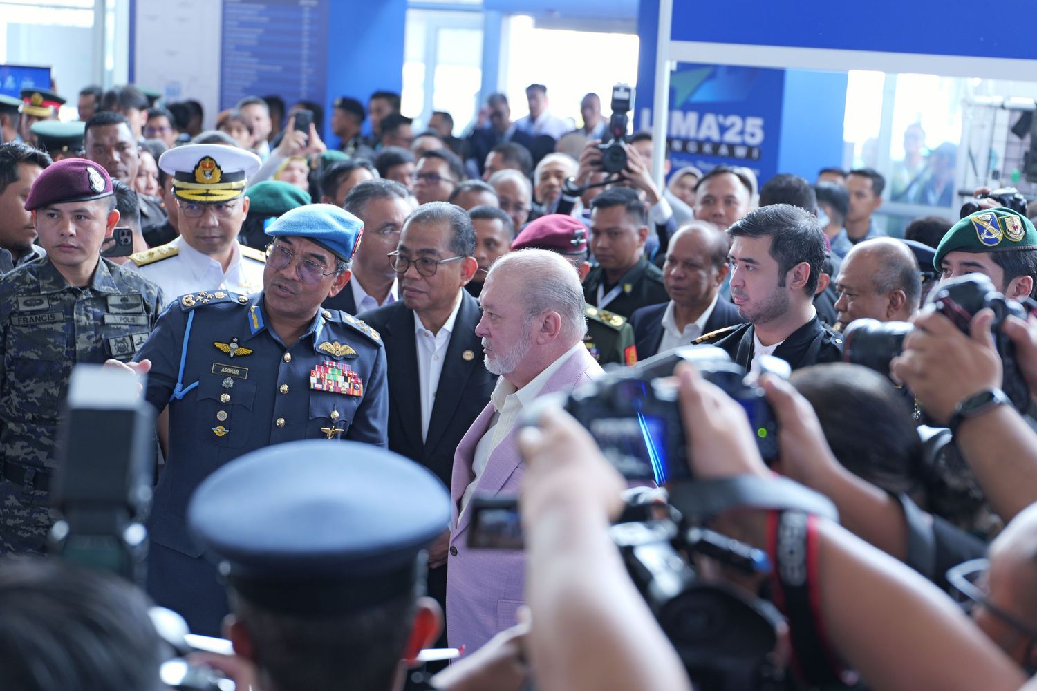 Large crowd of military personnel and attendees gathering at a formal defense industry conference.
