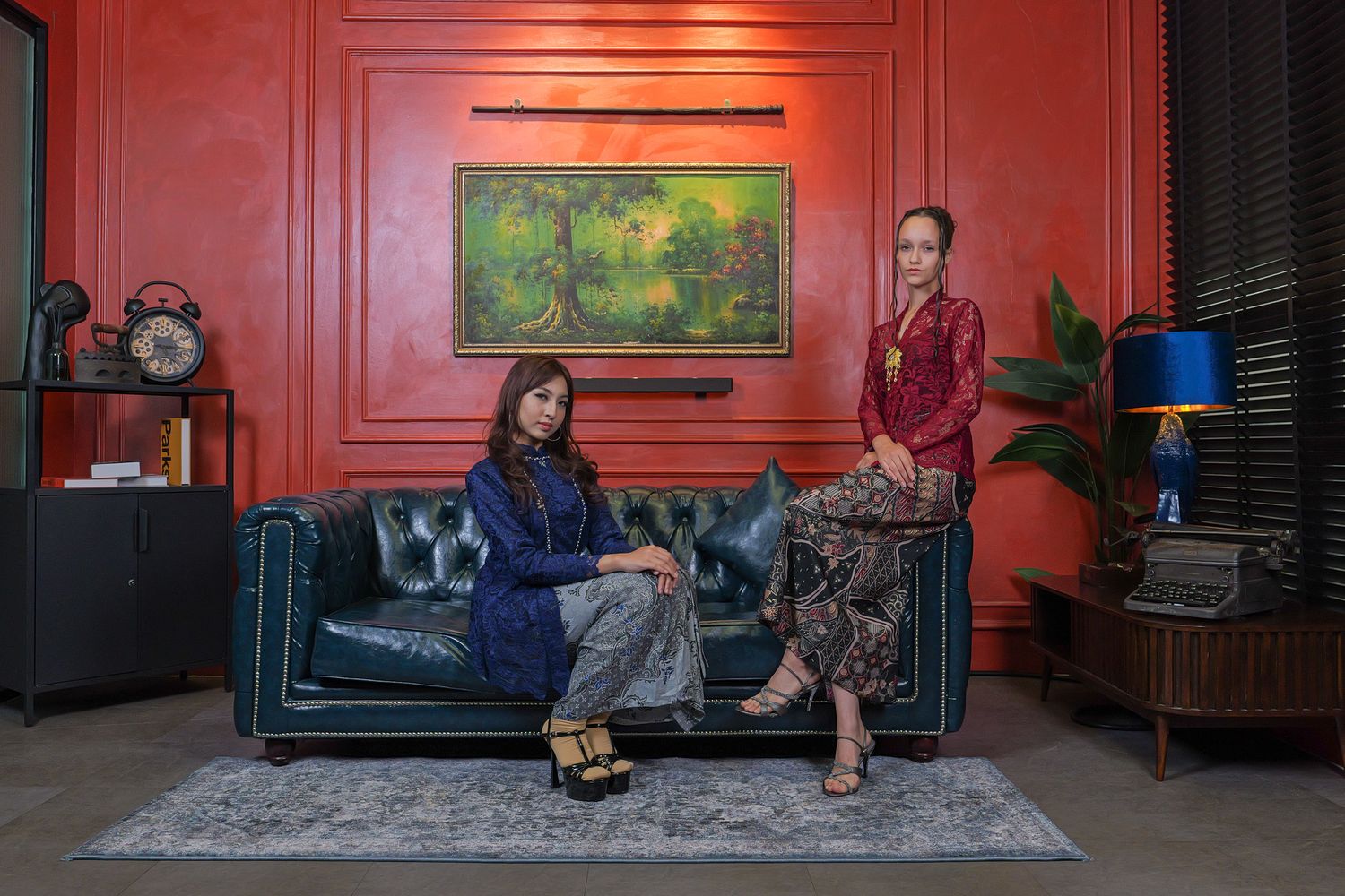 A series of five connected photos showing people sitting on furniture against a red wall in an interior space.