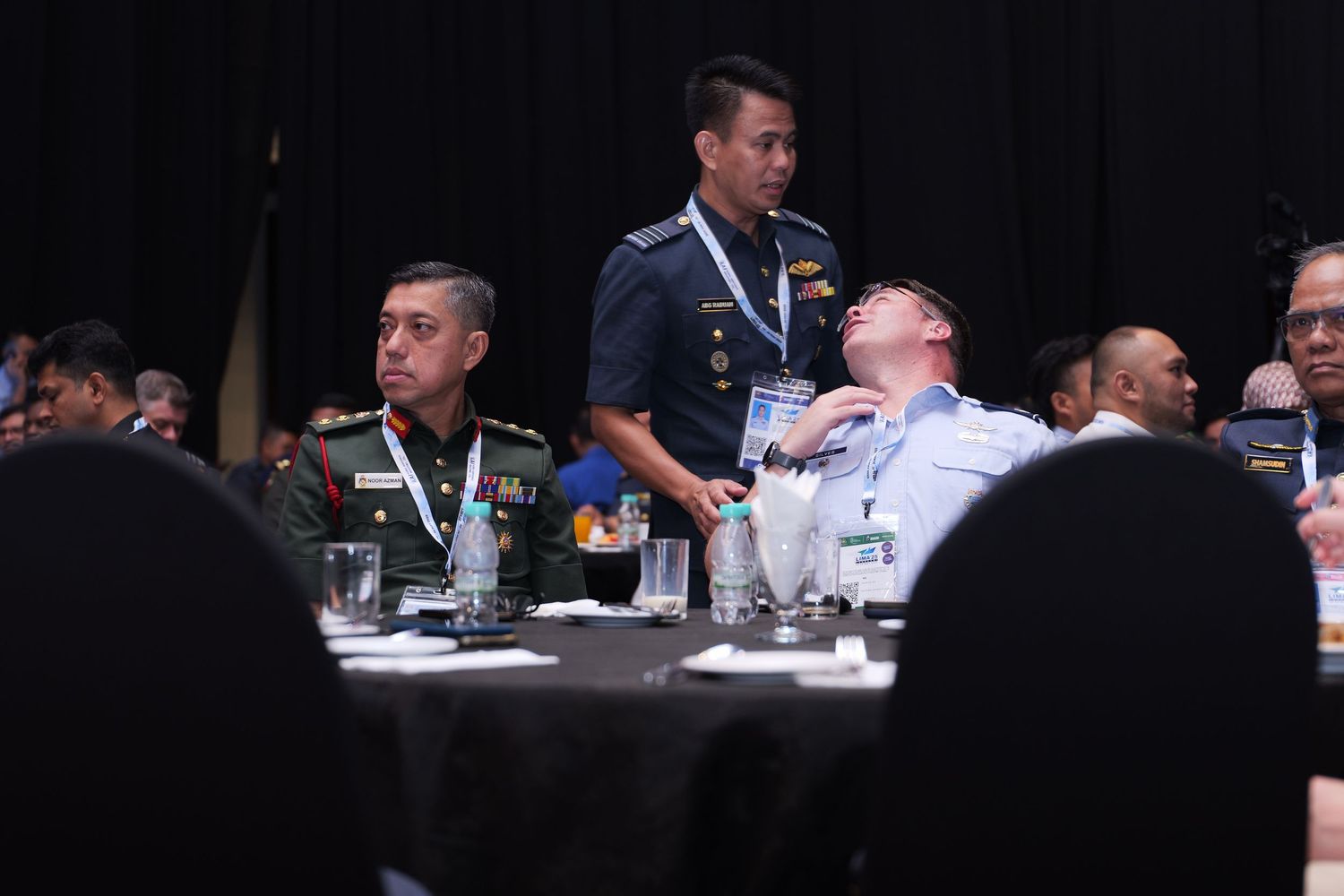 Conference attendees seated at round tables during an aviation industry event.