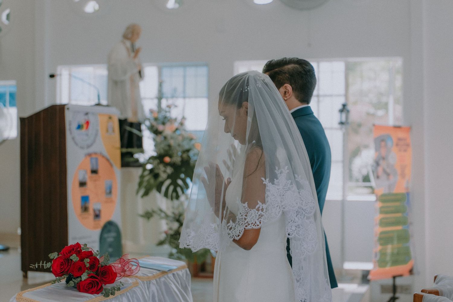 Interior view of modern church with romantic decor and natural lighting from large windows.