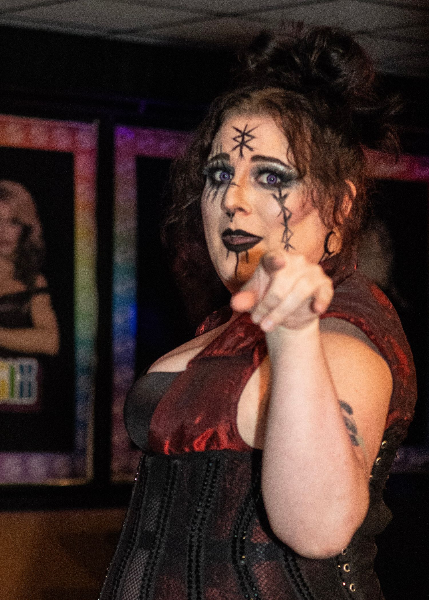 Gothic performer with face paint in dramatic theatrical poses.
