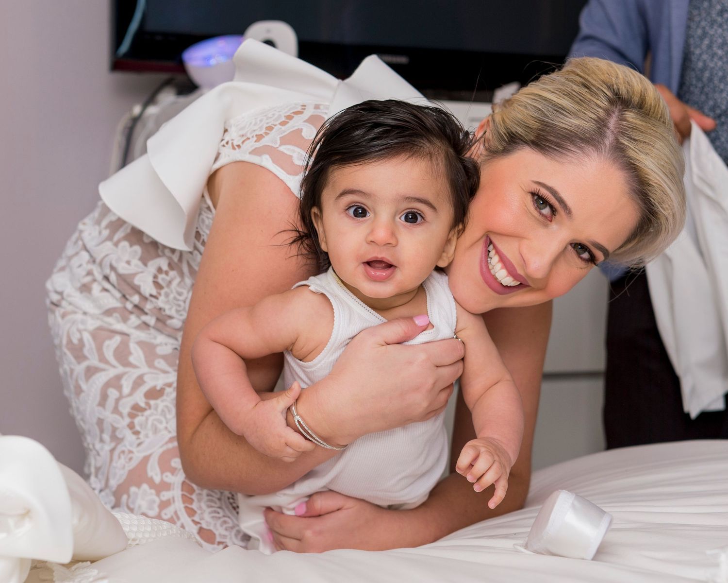 Collection of intimate mother and child portrait poses in white against neutral backgrounds.
