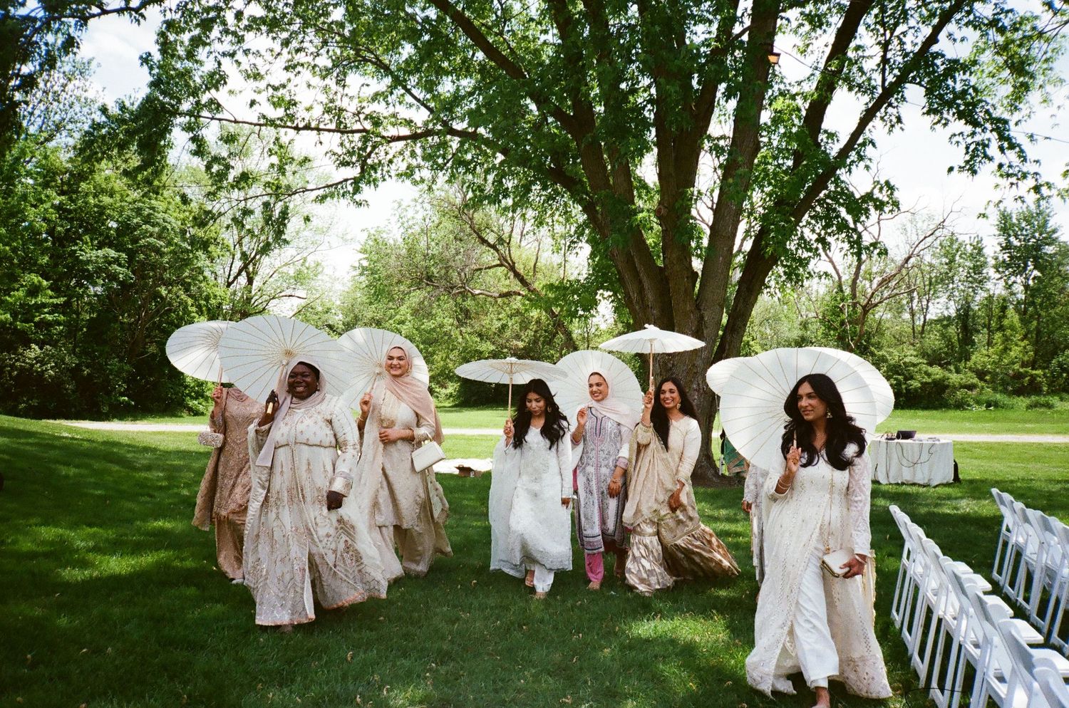 Bridesmaids parasols in hand; soft colors romance bridgerton, illinois revelry675 chicago suburbs venue south asian muslim