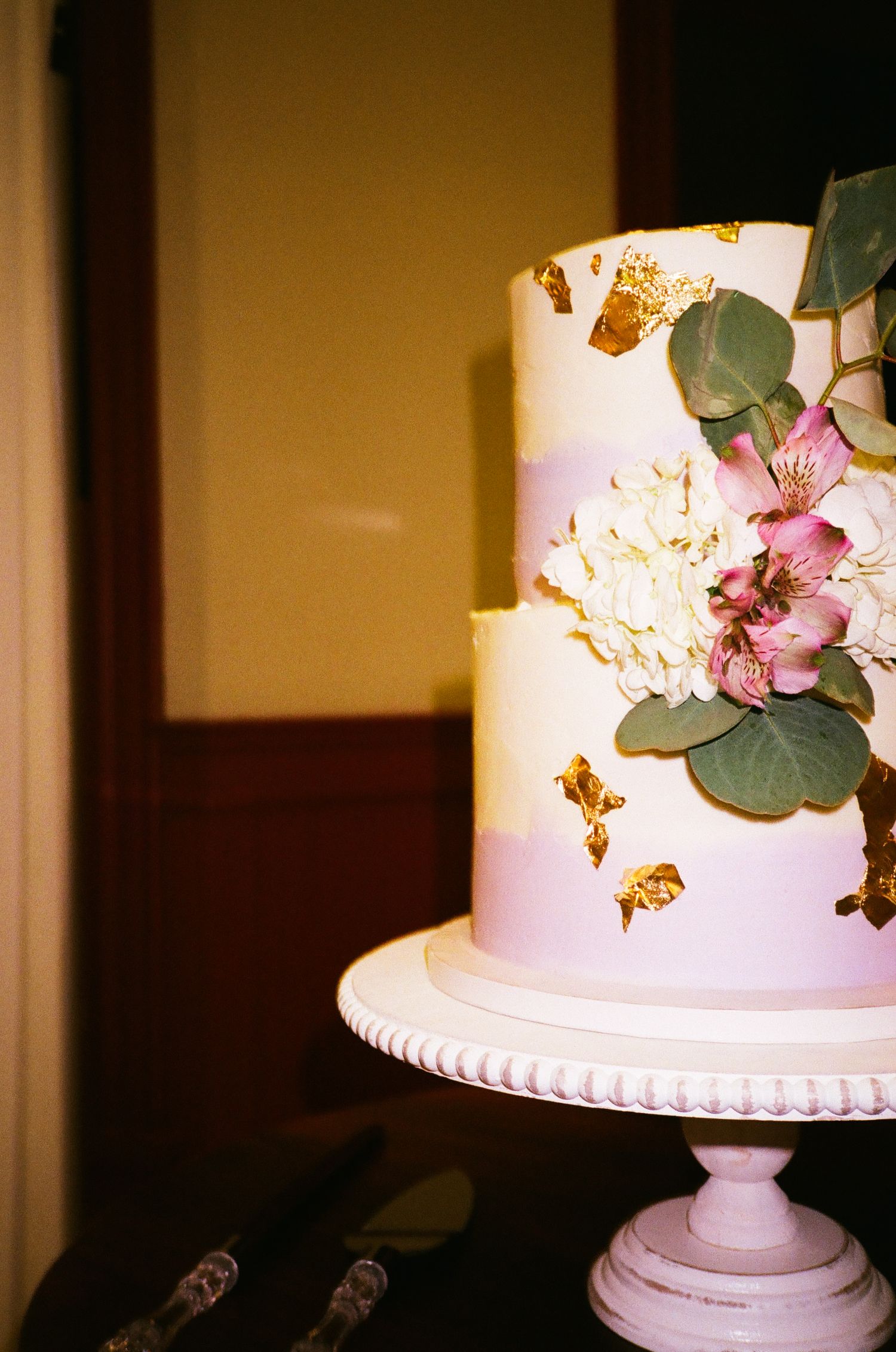 A floral wedding cake at a Chicago suburbs event, beautifully framed on classic 35mm film