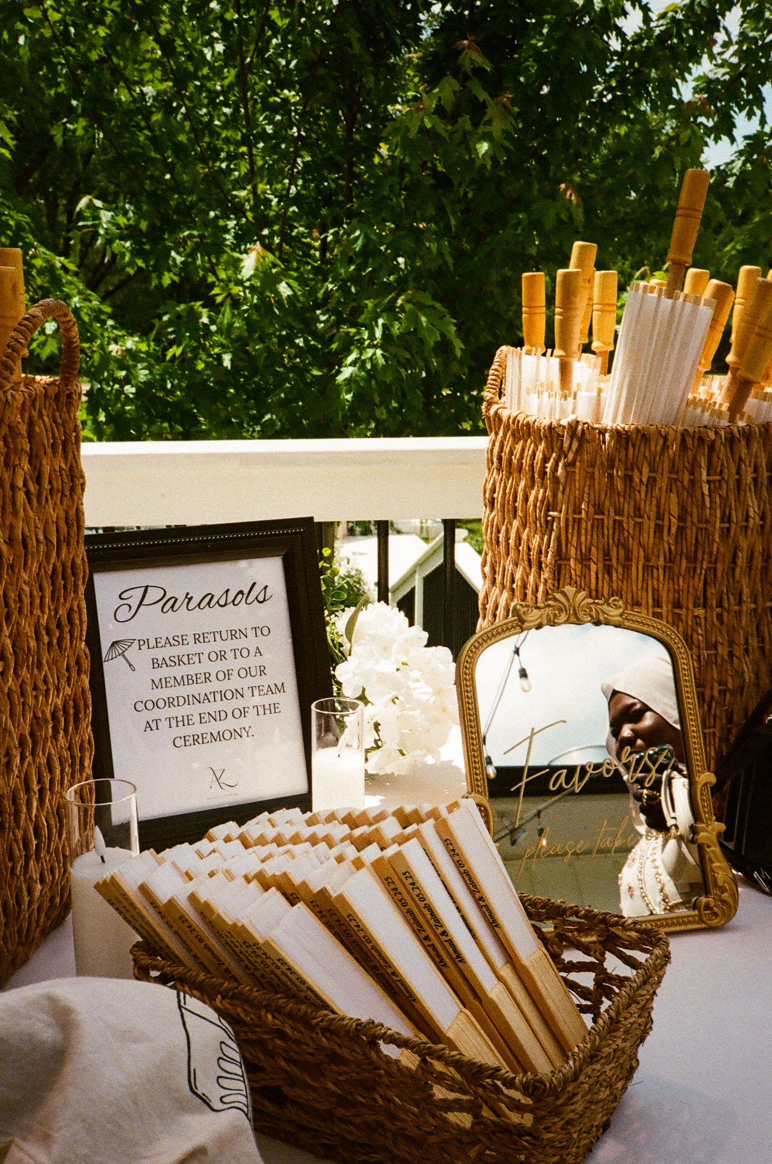 Summer garden Nikkah entry table with parasols and fans details beautifully captured on film in the Chicago suburbs. revelry675 venue