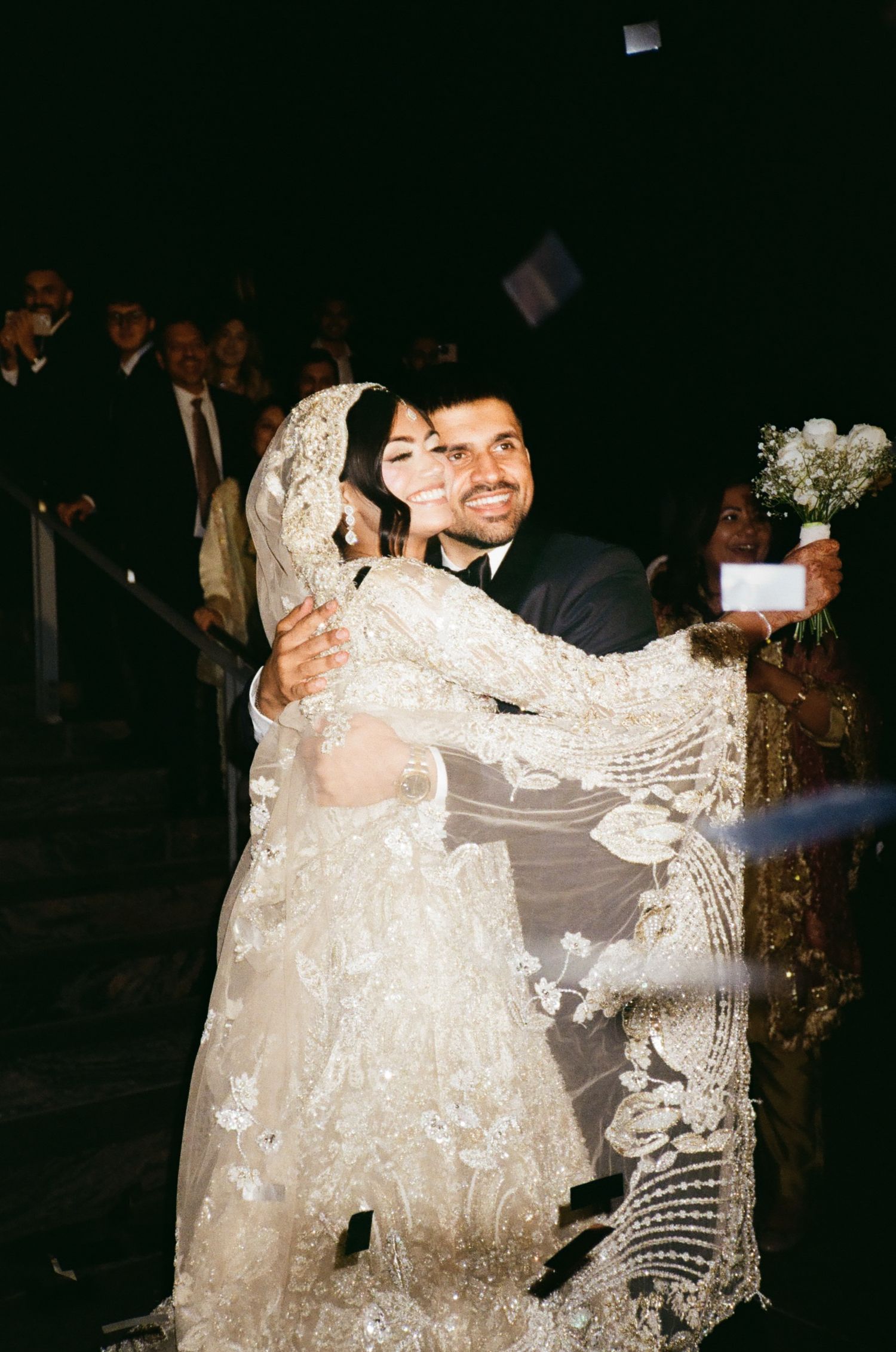 A classy Muslim Shia couple exits their adler Planetarium wedding chicago