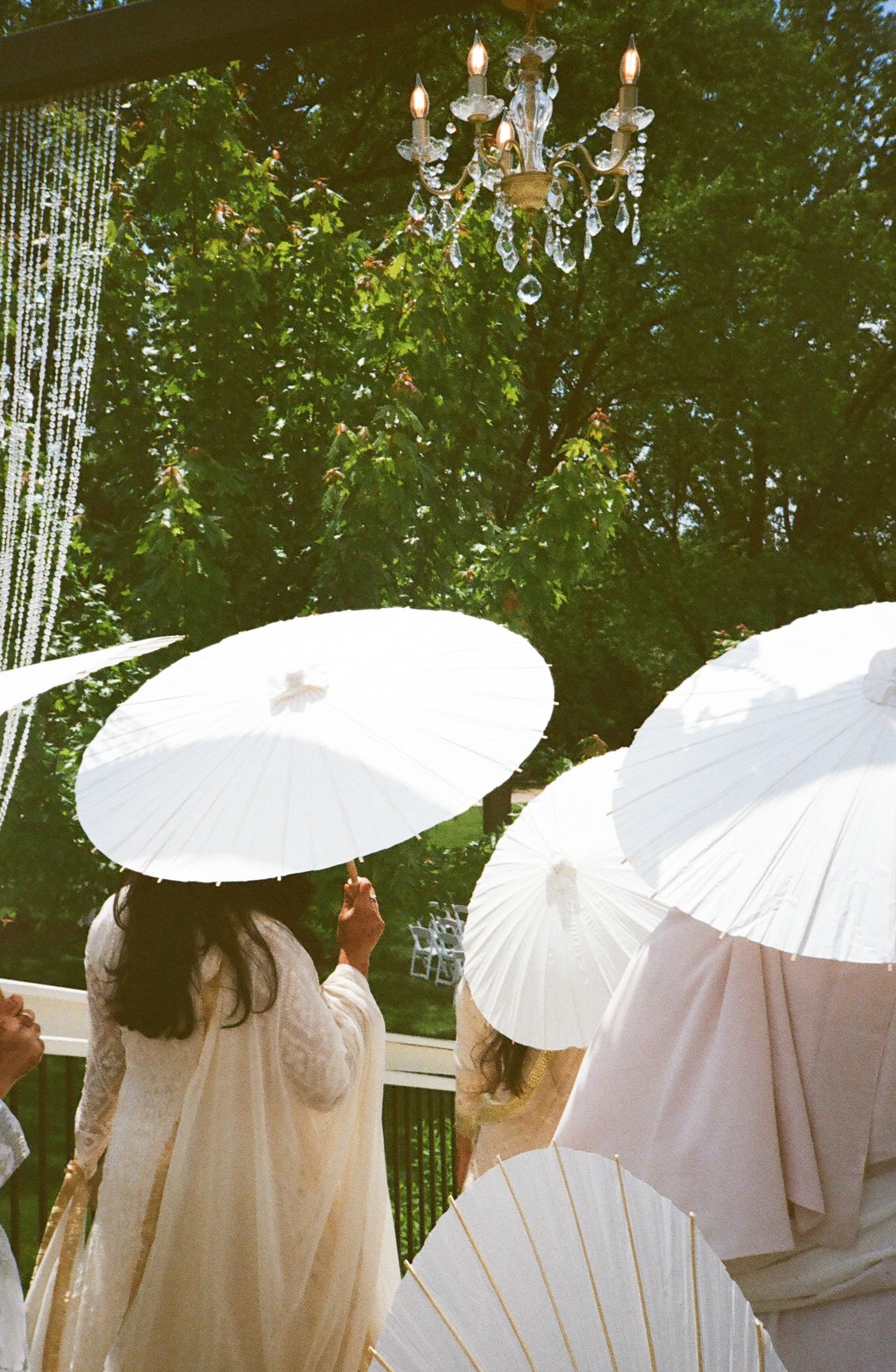 Bridesmaids  parasols in hand; soft colors romance bridgerton, illinois revelry675 chicago suburbs venue