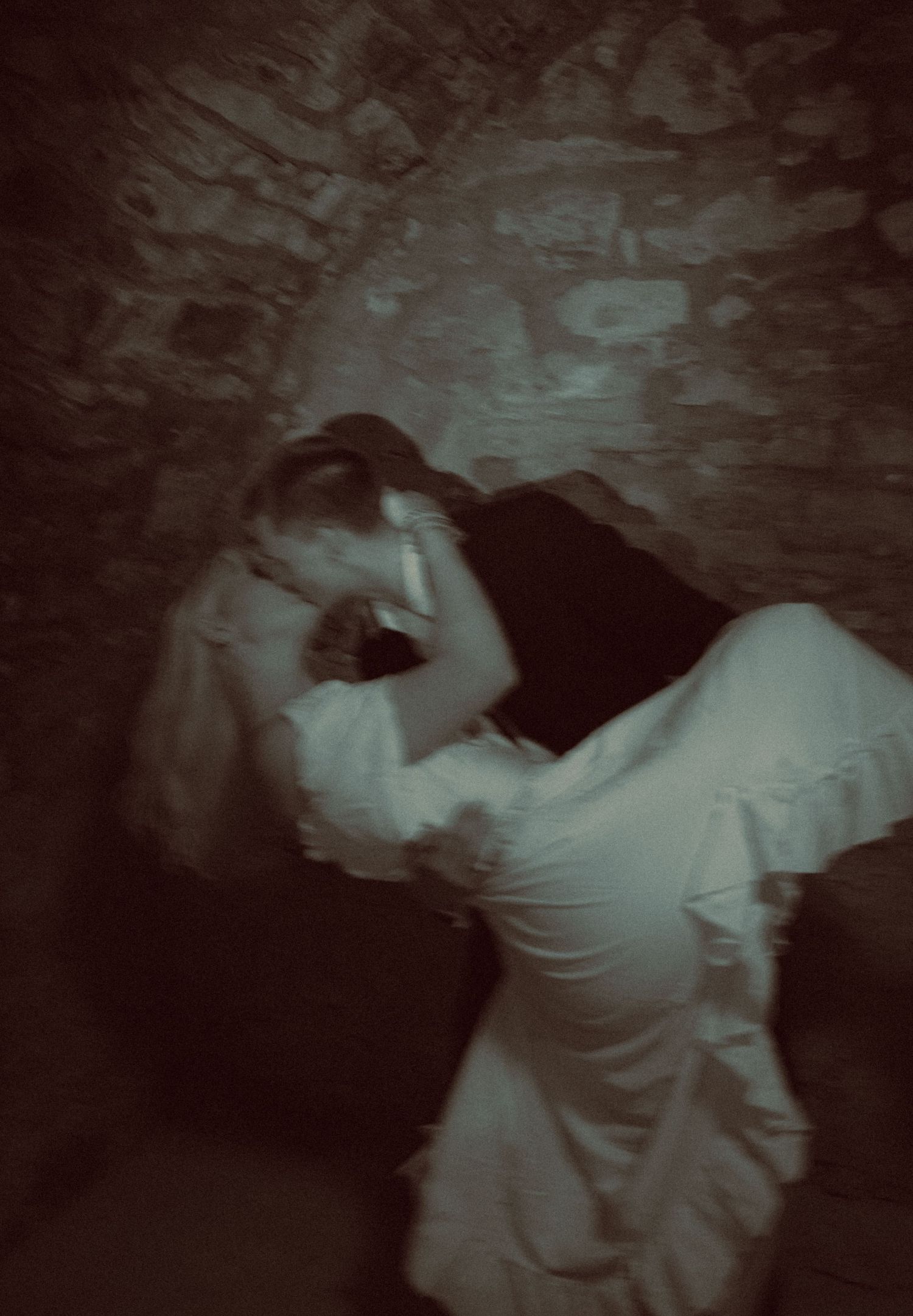 groom-dipping-and-kissing-his-bride-in-a-castle-B&W