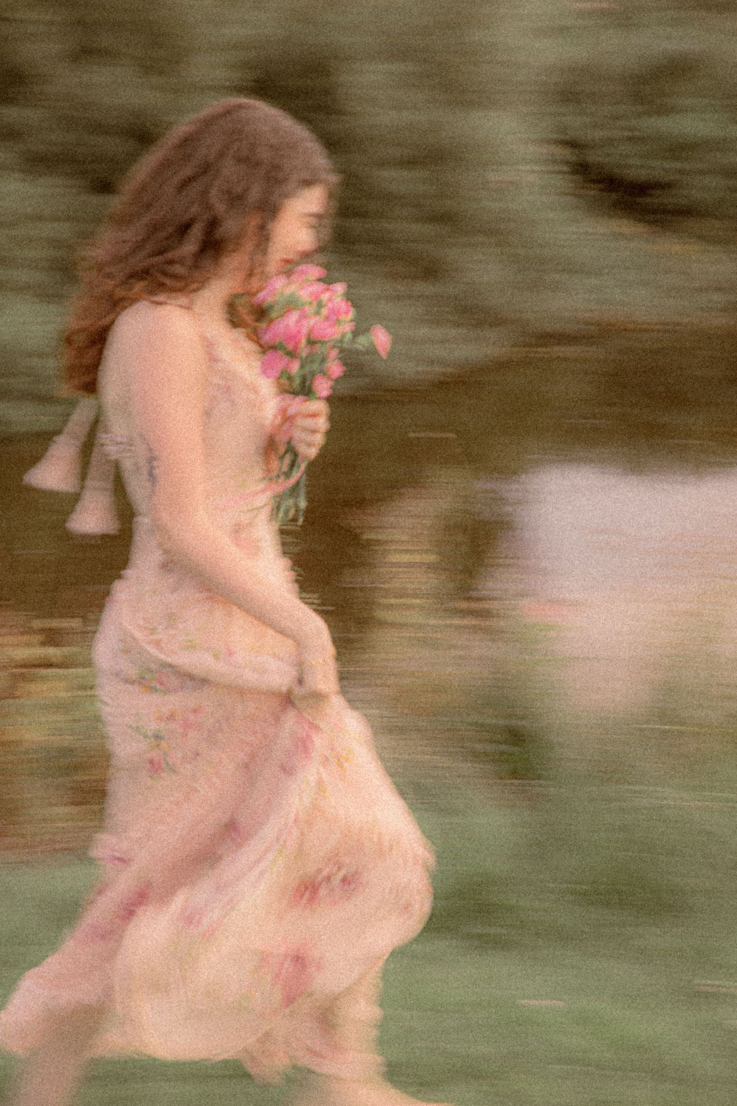 girl-running-barefoot-through-grass-holding-flowers