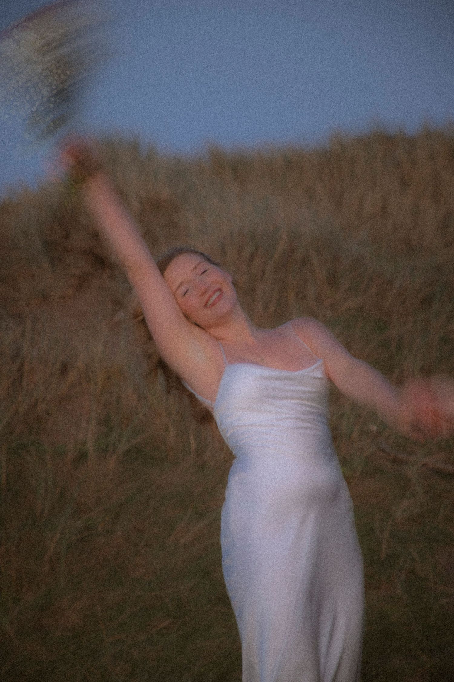 bride-running-with-flowers-during-evening-elopement