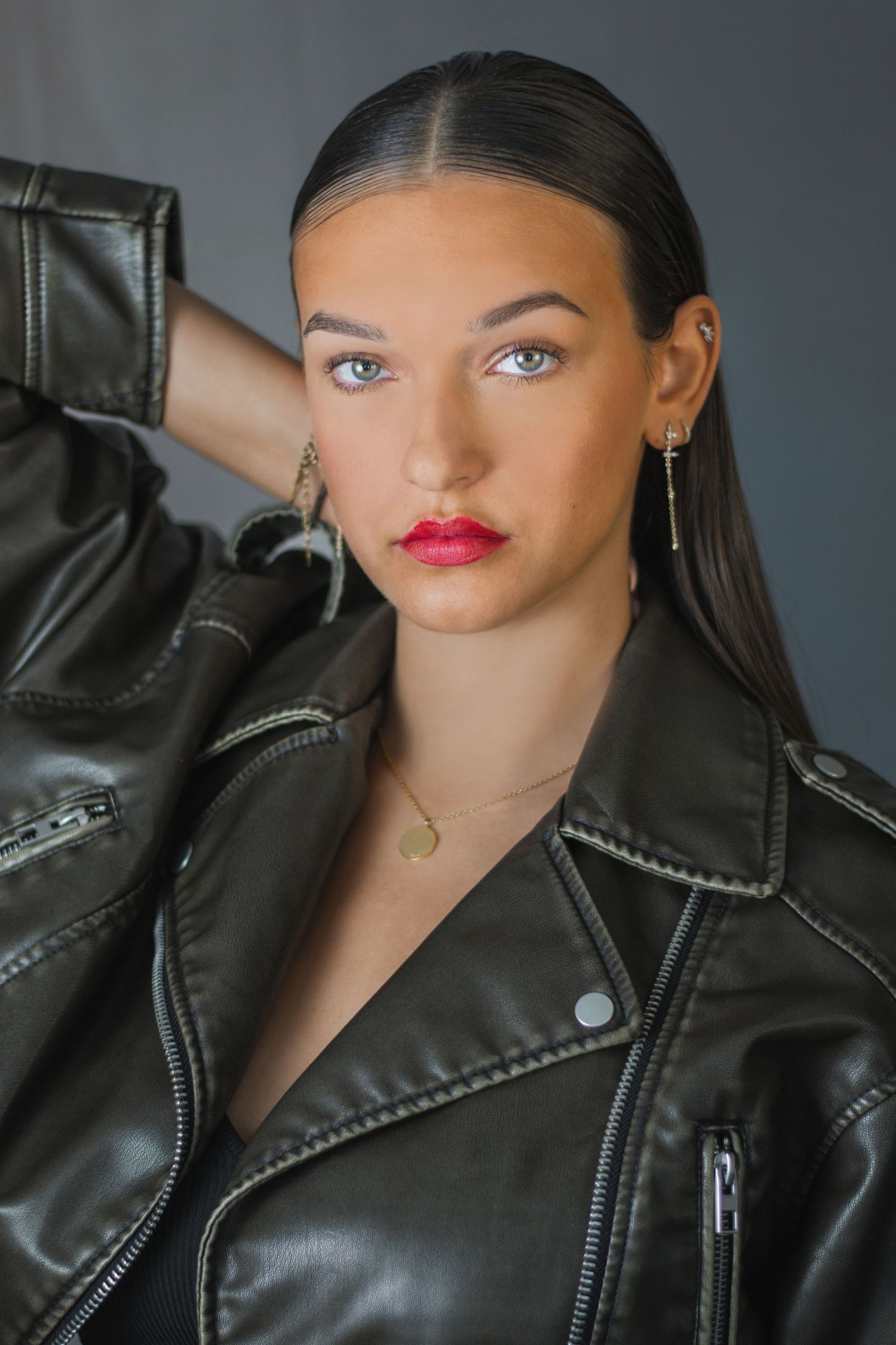 Fashion portrait series featuring glossy red lips and black leather jacket.