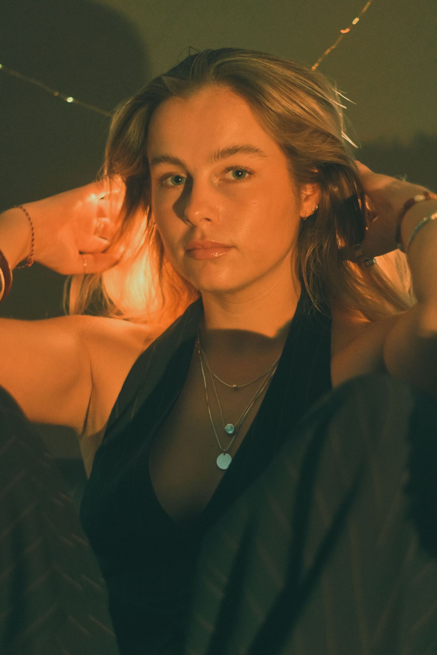 An atmospheric portrait sequence with warm lighting and expressive poses.