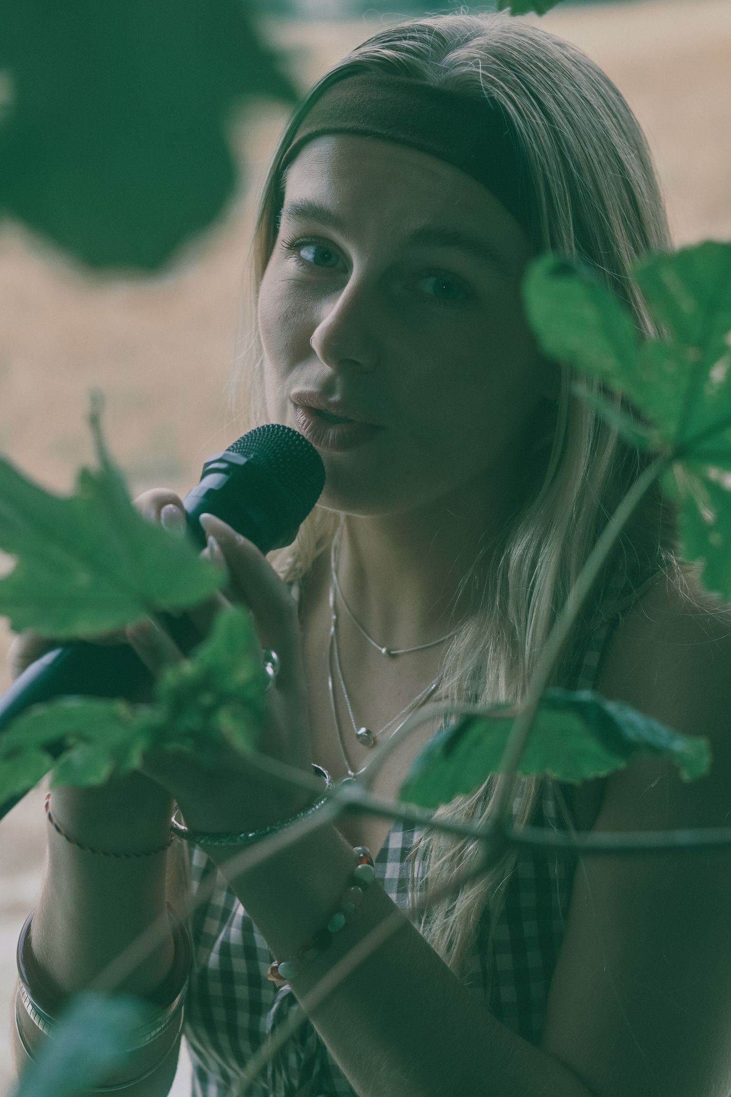 Ethereal photo sequence with leaves and greenery framing the subject.