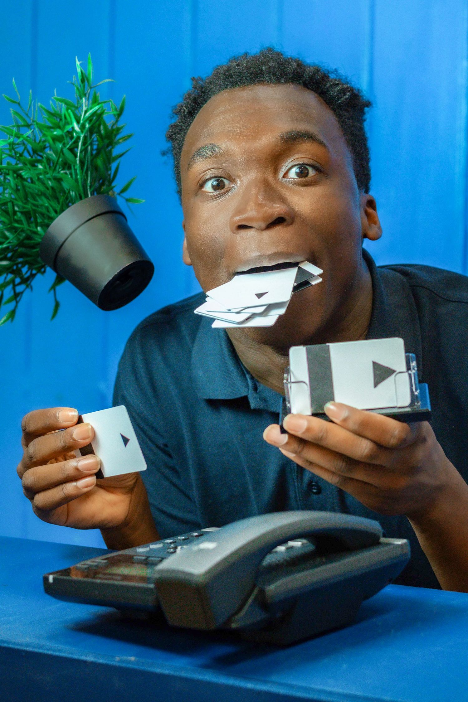 Sequence showing expressions while interacting with small white objects against blue background.