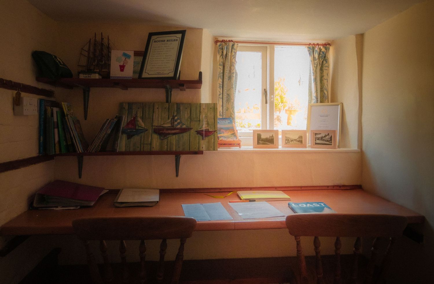 Interior panorama of a rustic room with windows letting in natural light.
