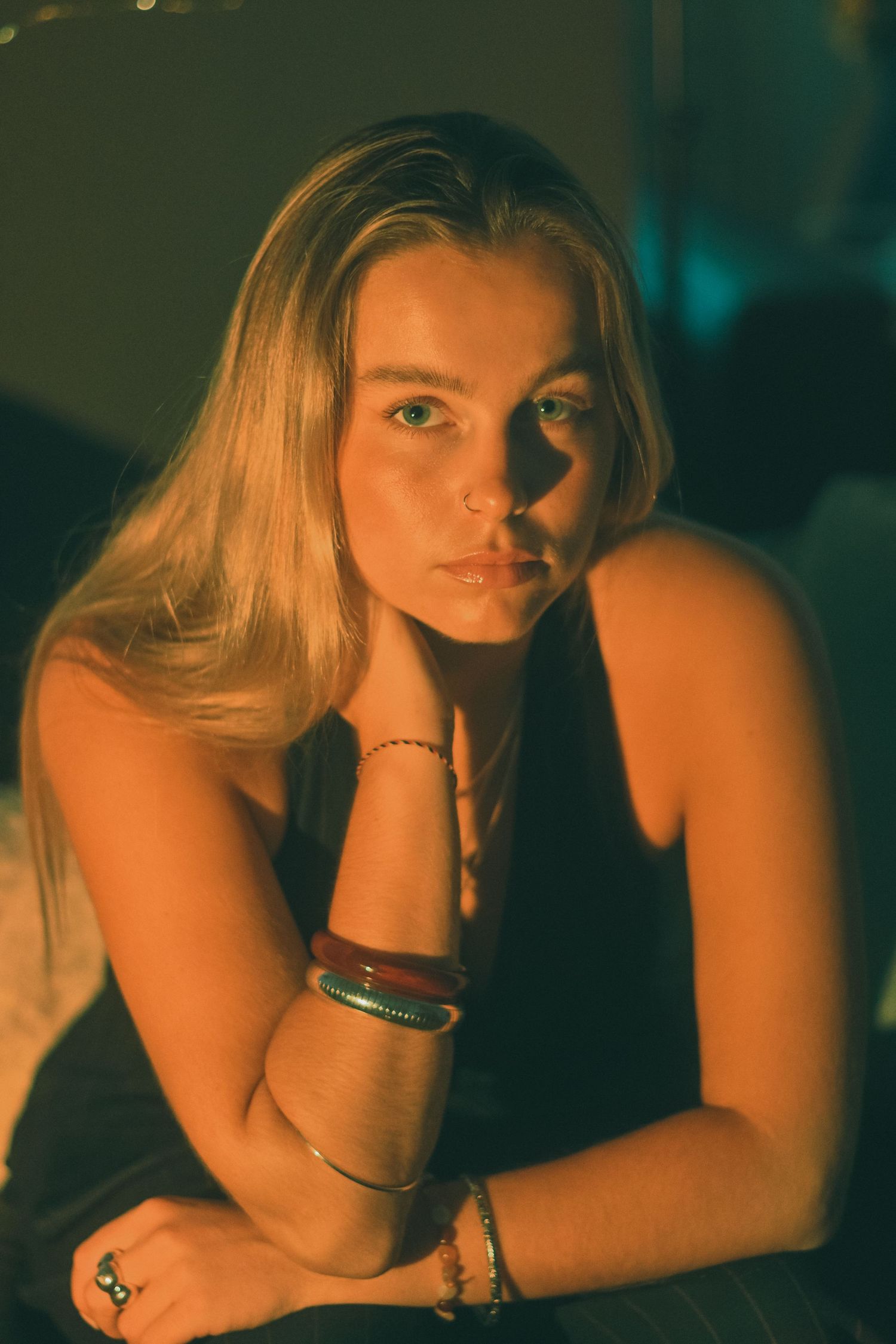 A vintage-inspired portrait series with dramatic lighting and jewelry details.
