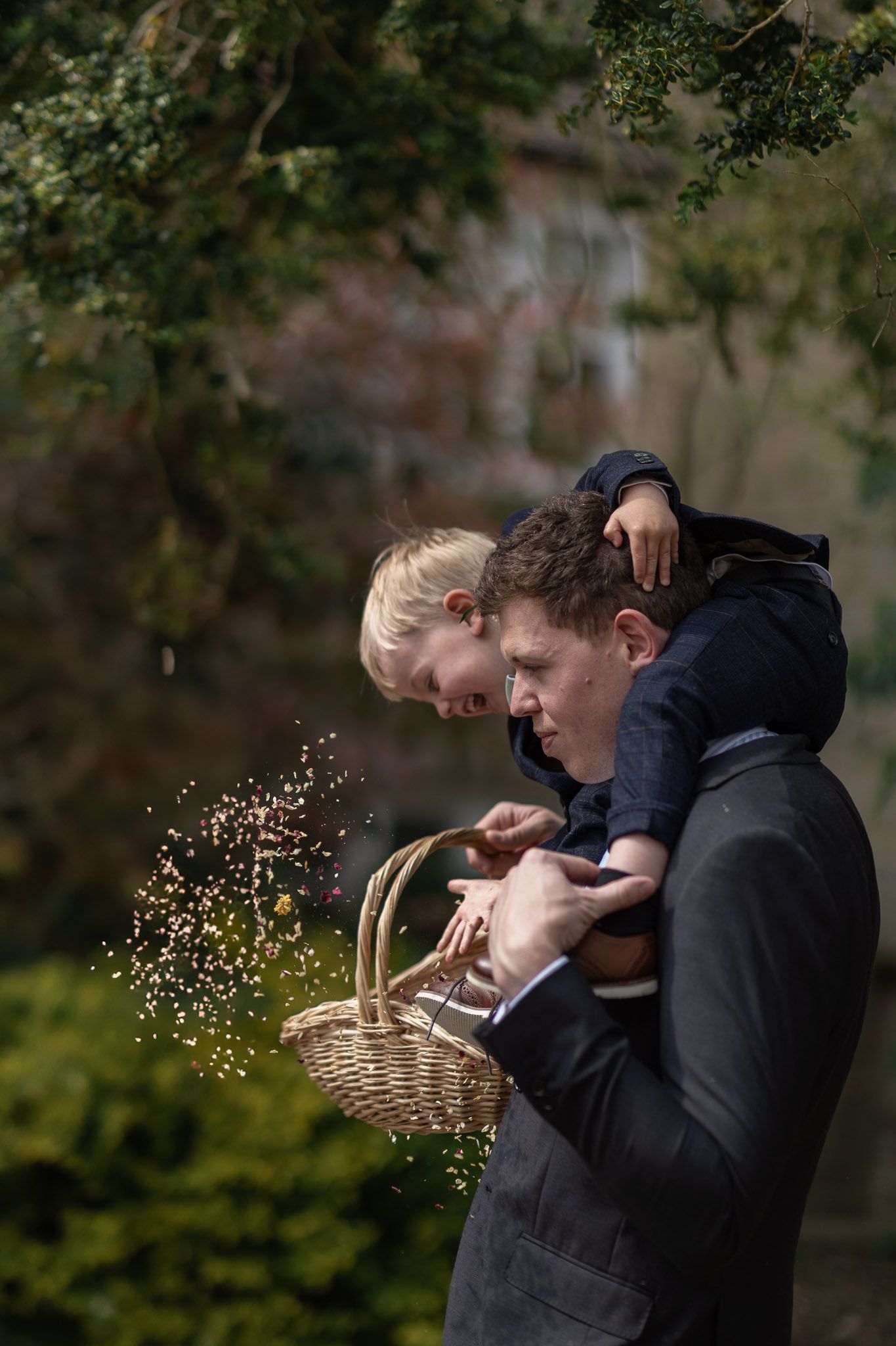 A touching moment as guests scatter confetti from a basket during the wedding celebration.