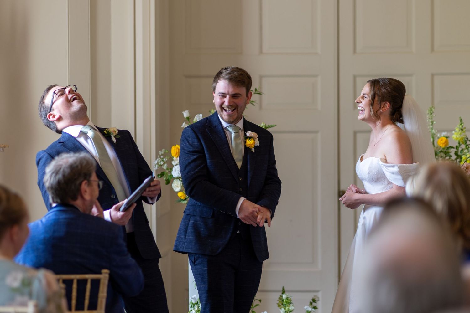 A sequence of candid wedding photos showing guests mingling and socializing in an elegant indoor venue.