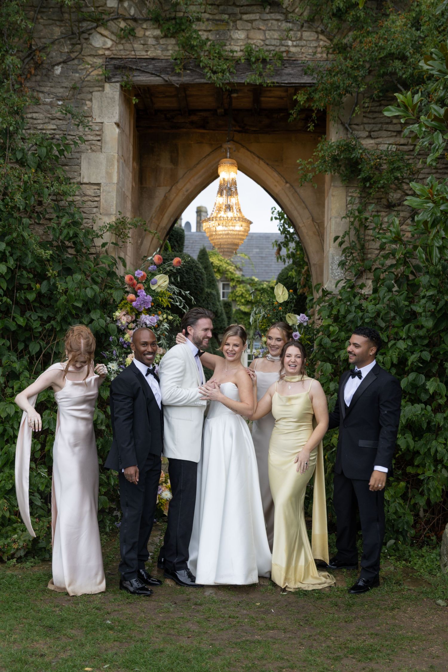 Couple walking through the gardens during an outdoor wedding at Euridge Manor, photographed by Wiltshire wedding photographer