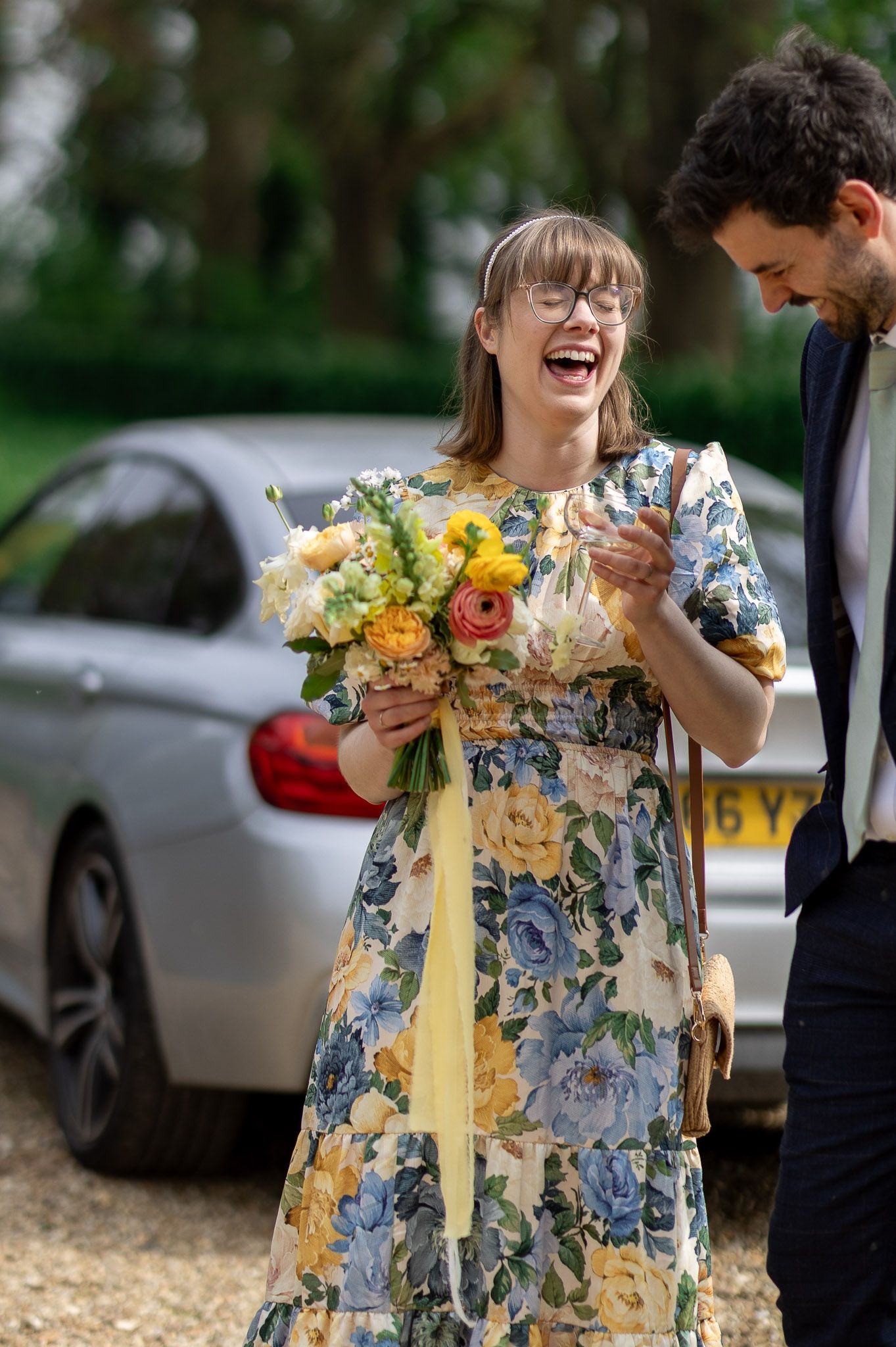 Candid moments of laughter and joy captured during an outdoor wedding celebration.