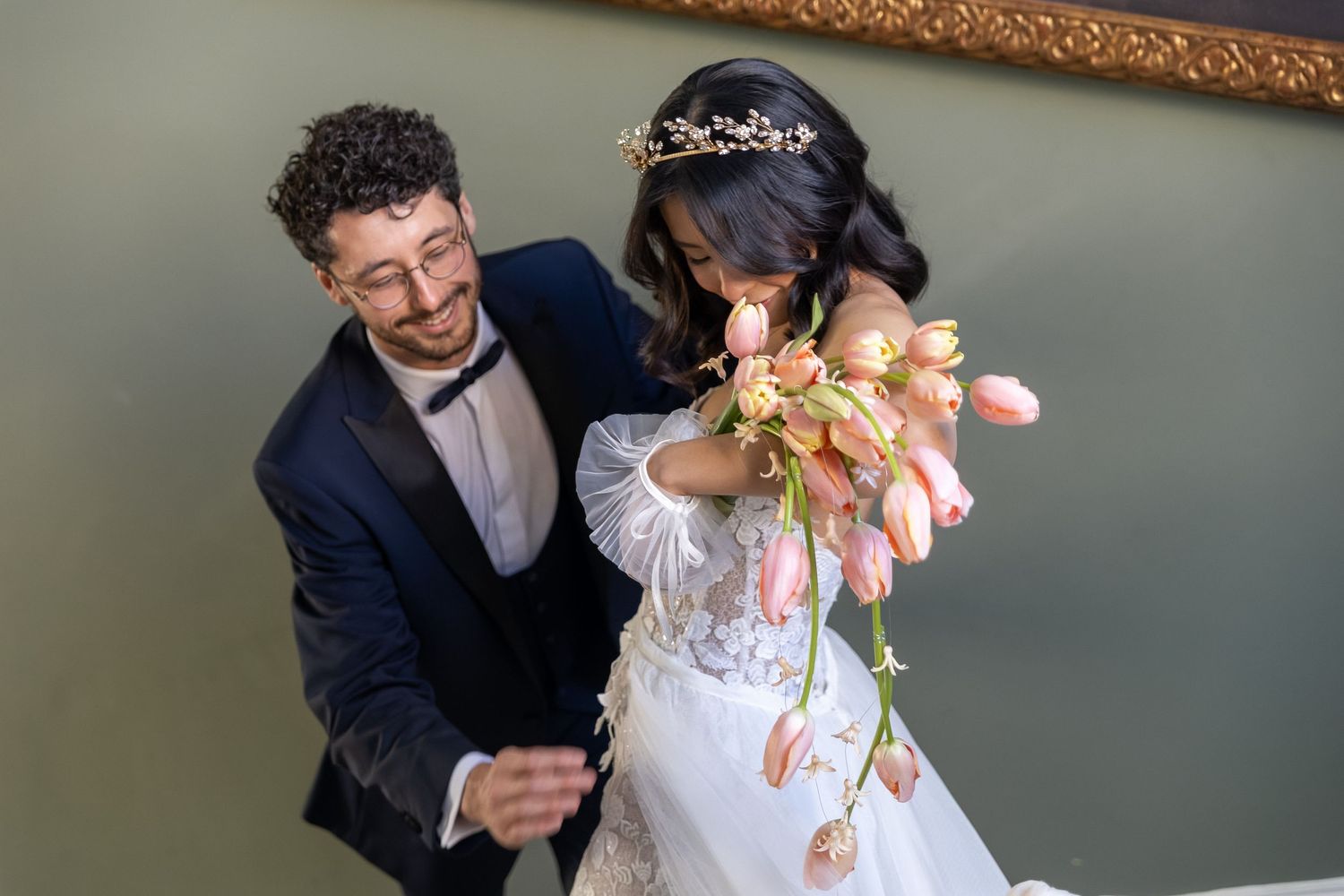 A bride and groom share a joyful moment during their wedding celebration.