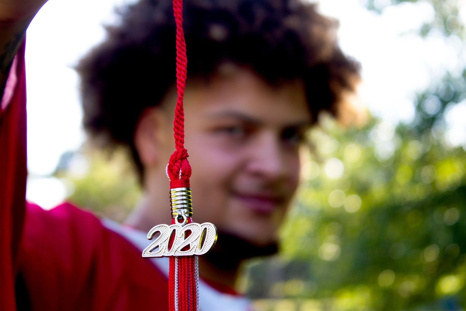 Creative outdoor portrait with warm lighting and a soft-focus background.