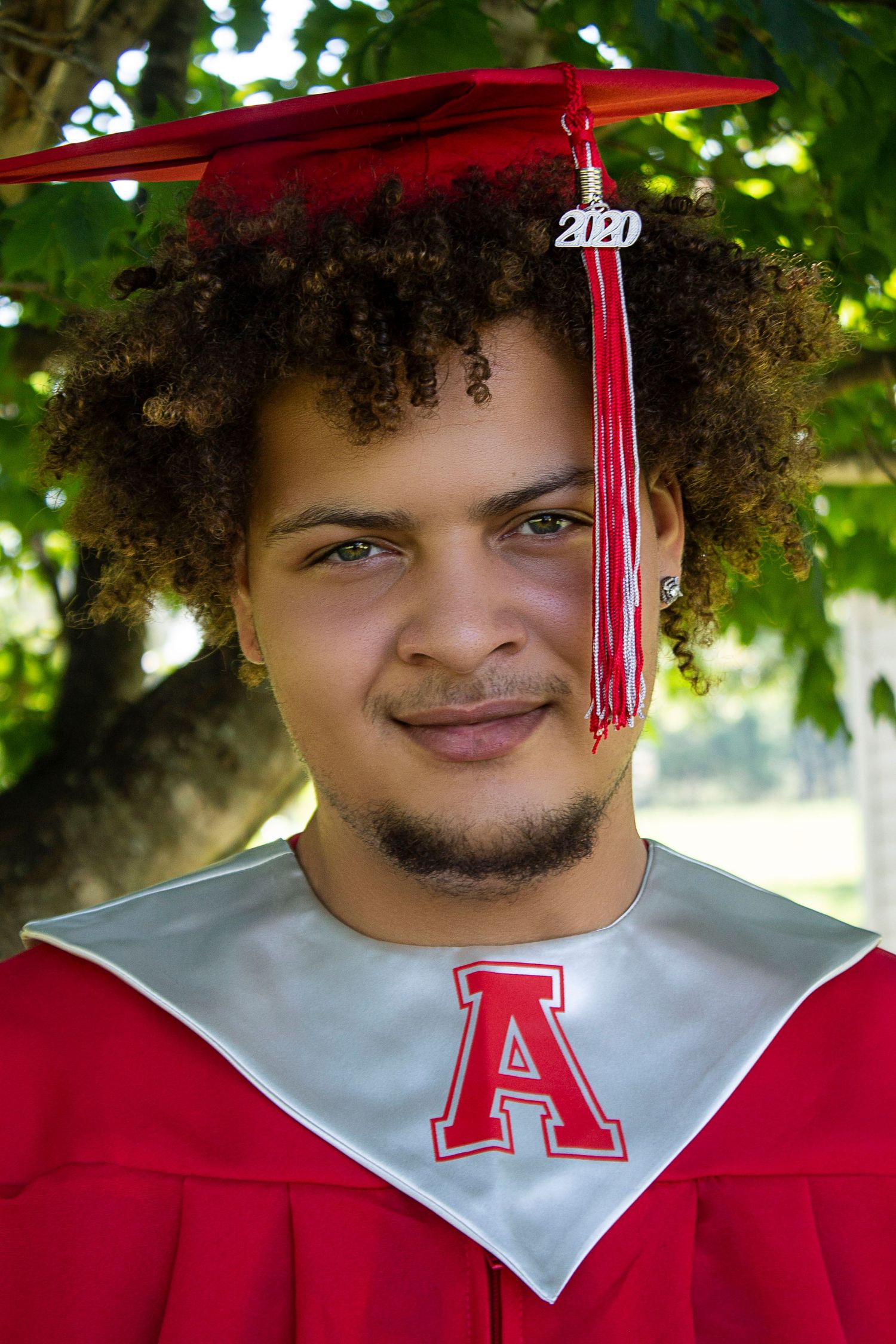 Outdoor portrait showcasing natural skin tones and subtle expression.