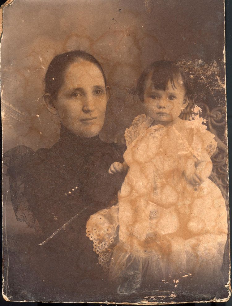 Damaged photo of mother and child