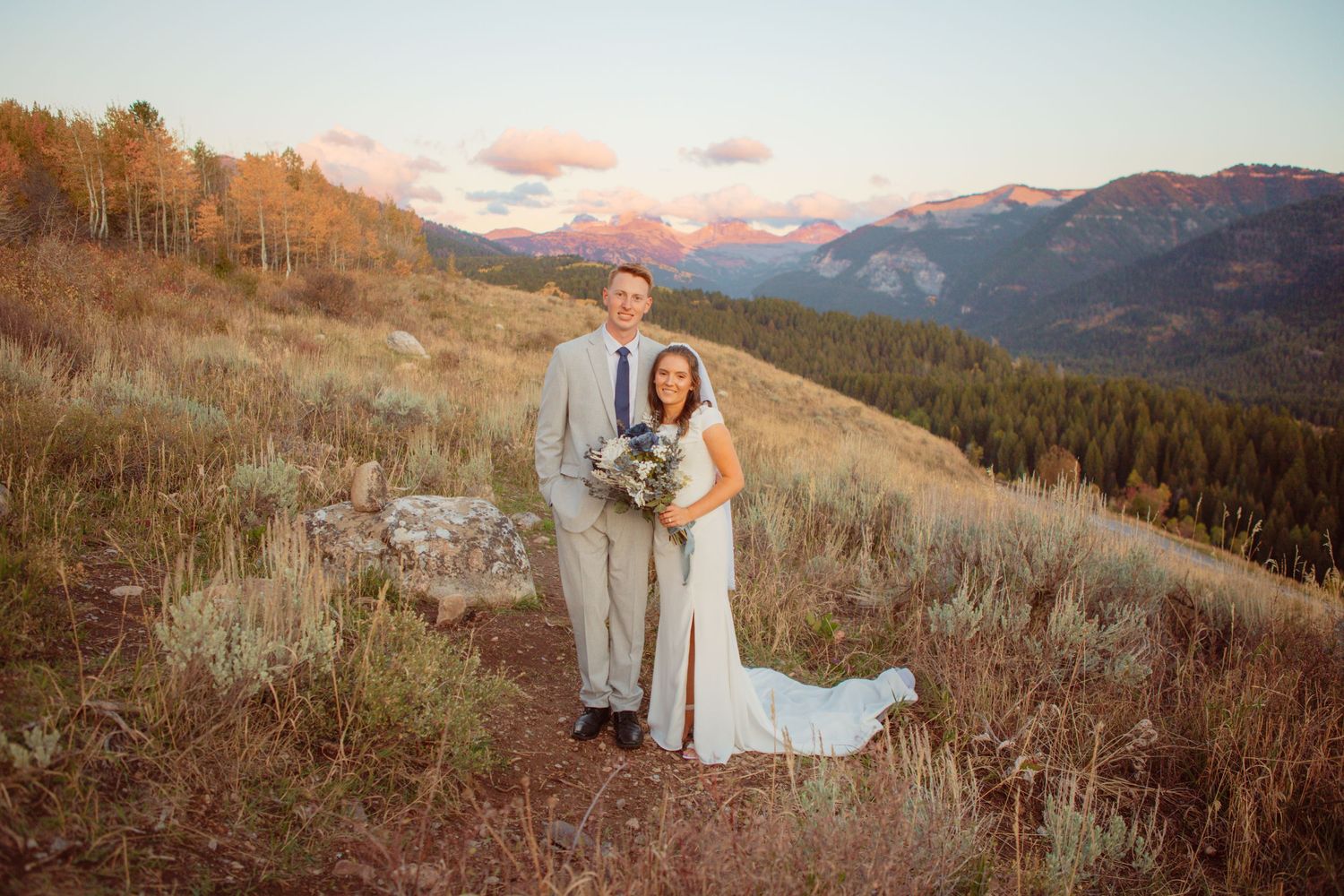 Romantic sunset wedding photos with couples silhouetted against mountain vistas.