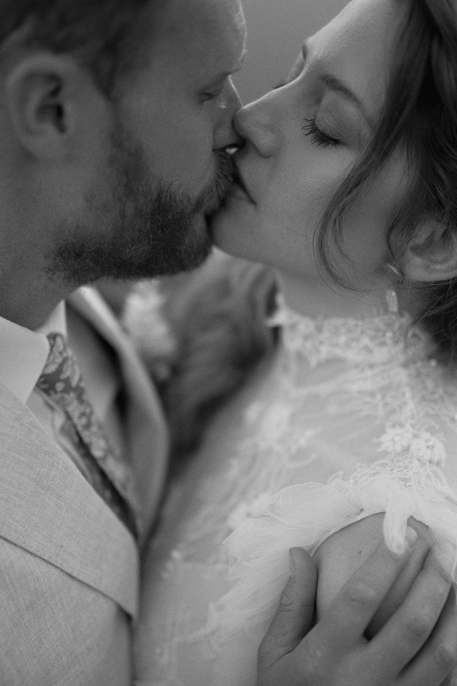 Bride and groom sharing a tender moment in golden sunlight at Cape Town wedding