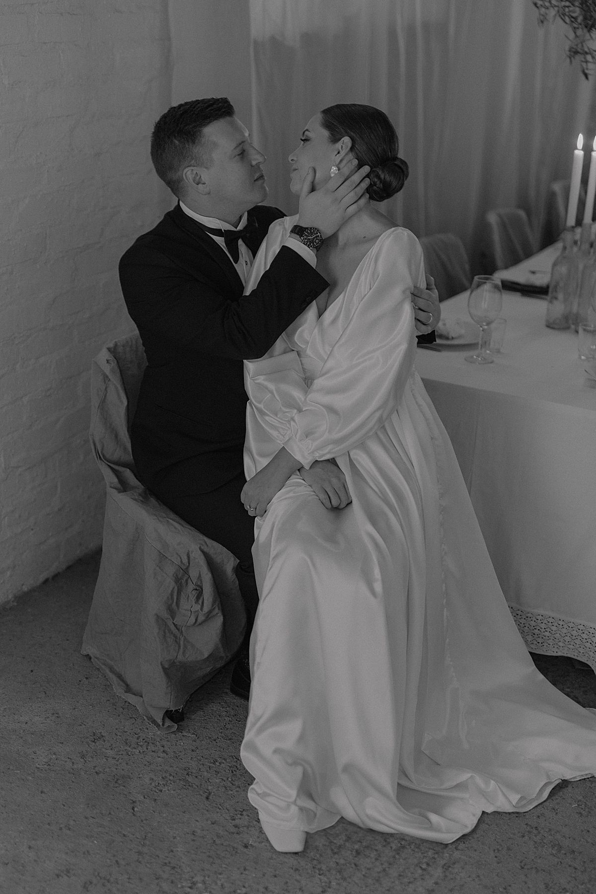 Bride and groom sharing a tender moment in golden sunlight at Cape Town wedding