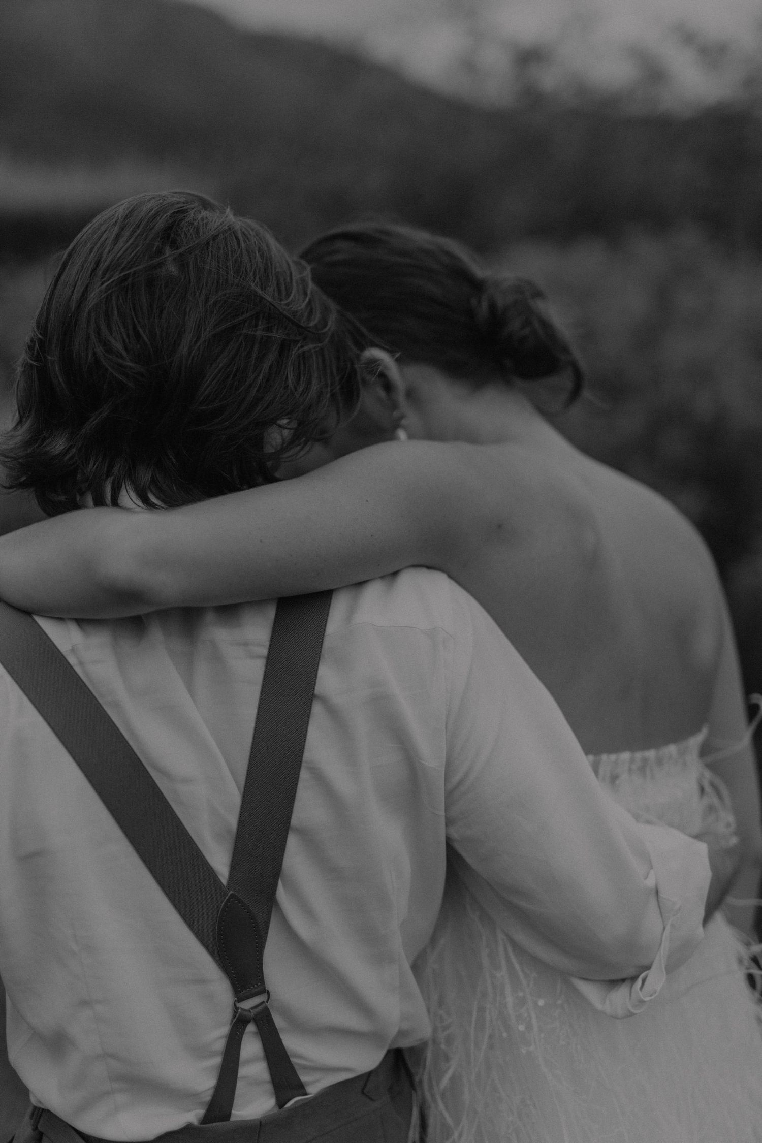Bride and groom sharing a tender moment in golden sunlight at Cape Town wedding