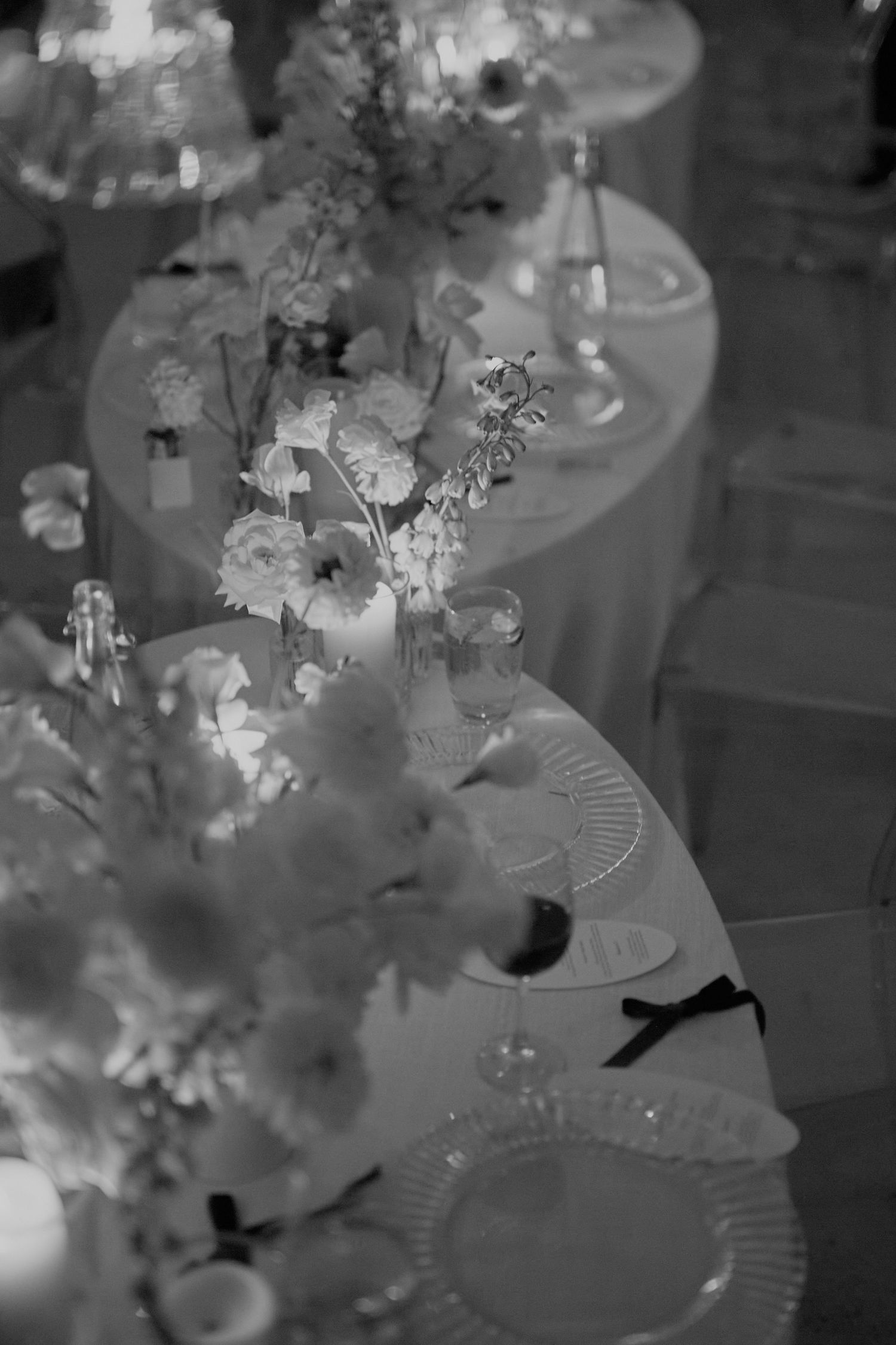 Newlyweds smiling and toasting guests during joyful wedding reception celebration