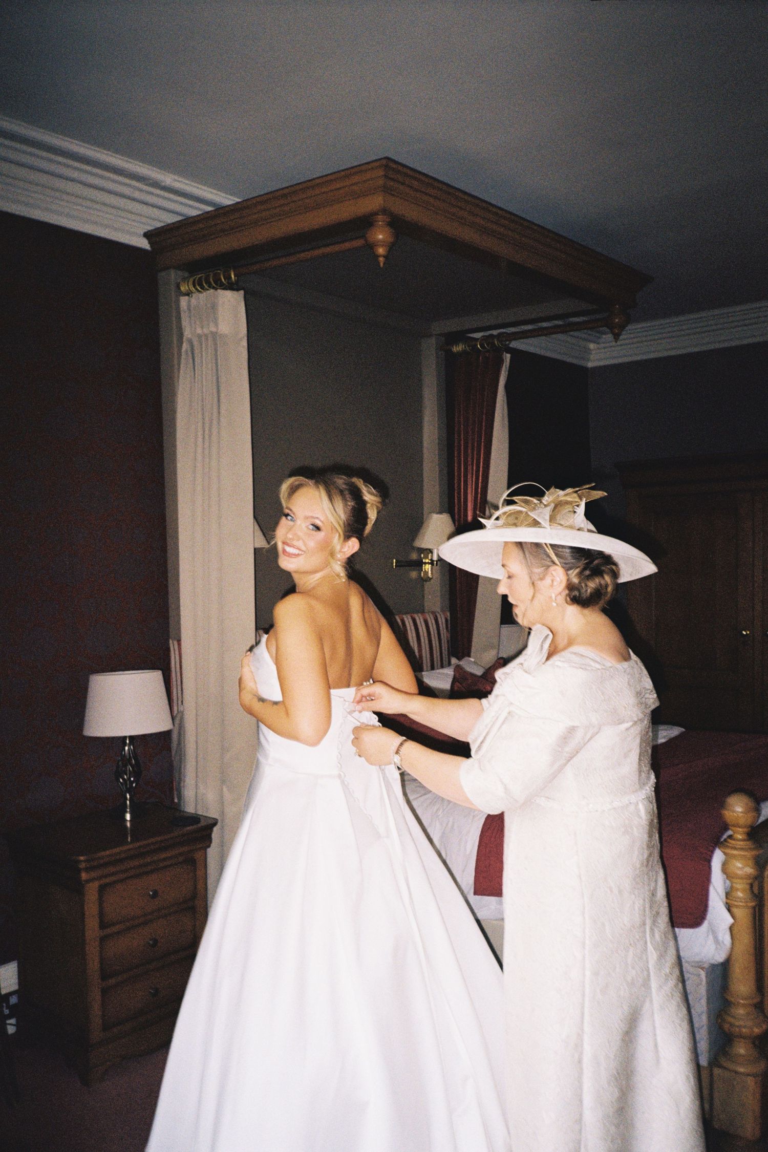 A sequence of photos showing wedding preparation moments with people in white dresses getting ready in a dimly lit room.