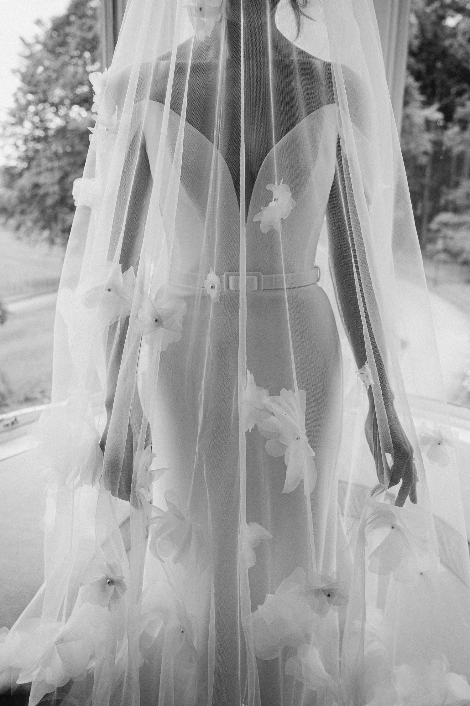 A delicate bridal veil with floral appliques captured in black and white photography. Aberdeen Wedding Photography, Douneside House