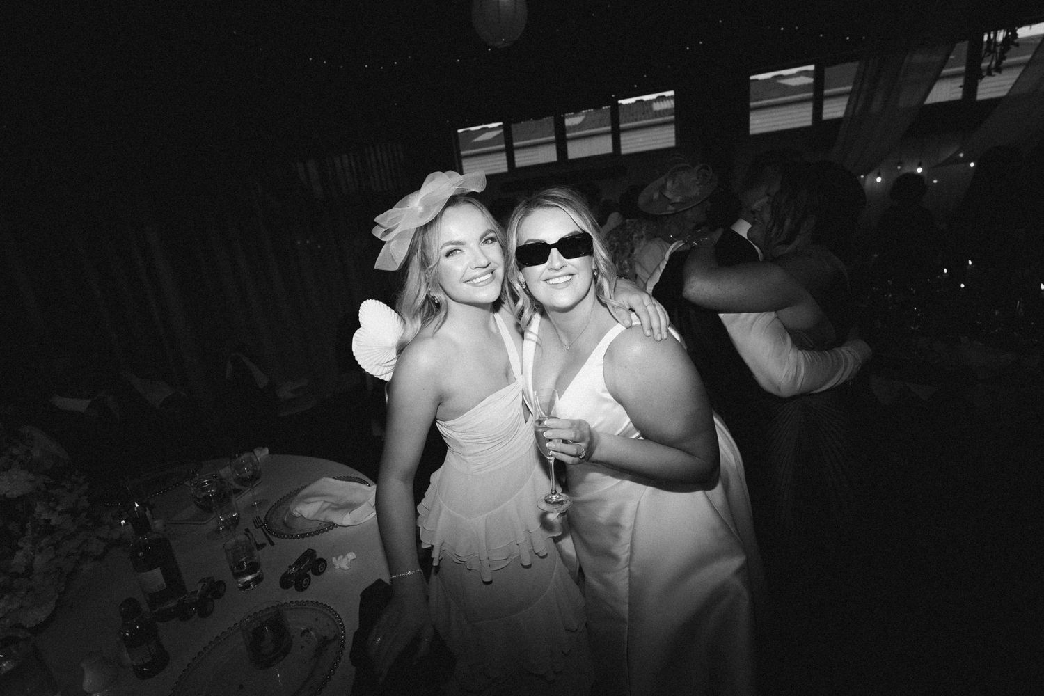 A collage of black and white party photos showing people dancing and celebrating at a social event.